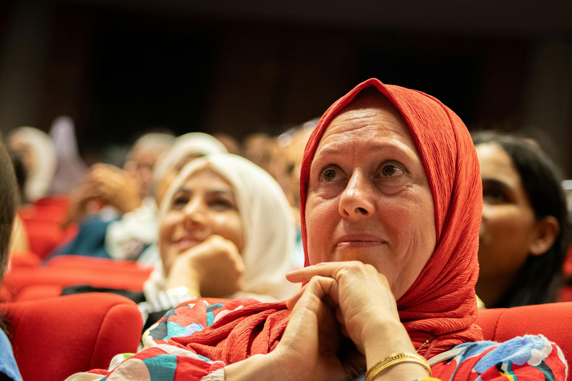 A diverse audience reacting emotionally during a debate, highlighting the importance of audience connection. — emotion i…