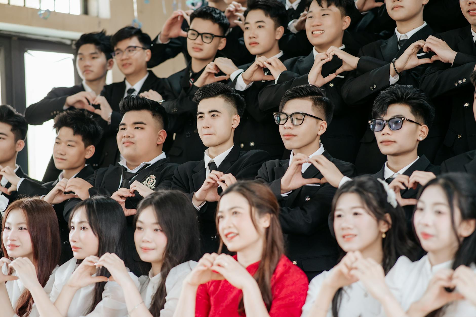 A diverse group of students engaged in a formal debate, showcasing different cultural backgrounds. — cultural perspectiv…