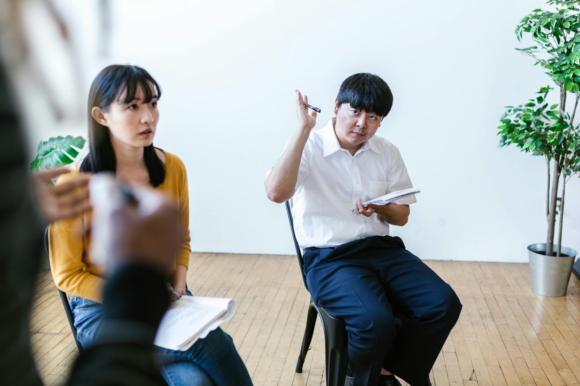 A photo of a debate team engaging in active listening during a practice session. — psychology of debate