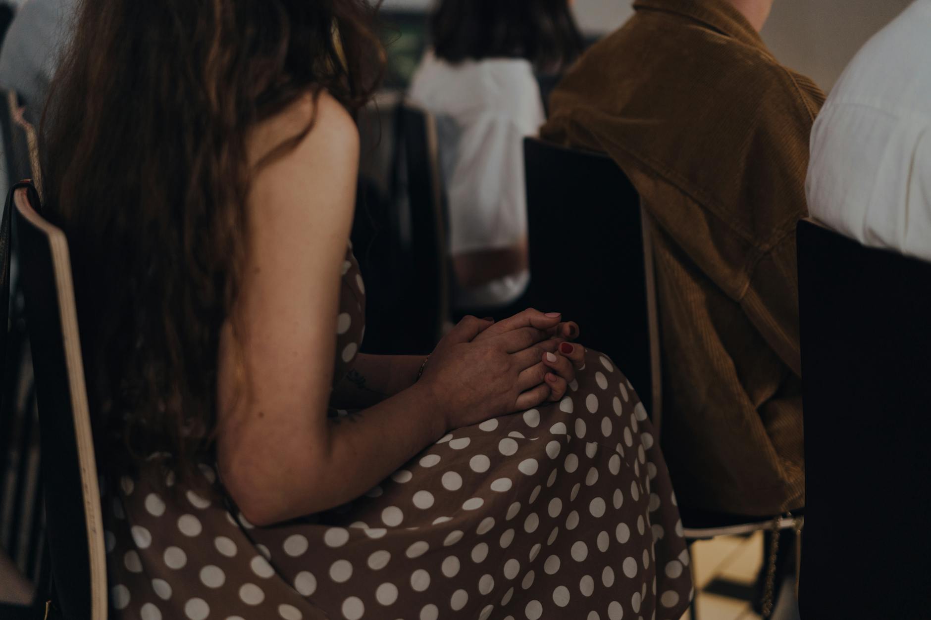 A calm individual listening attentively during a heated discussion. — emotional arguments