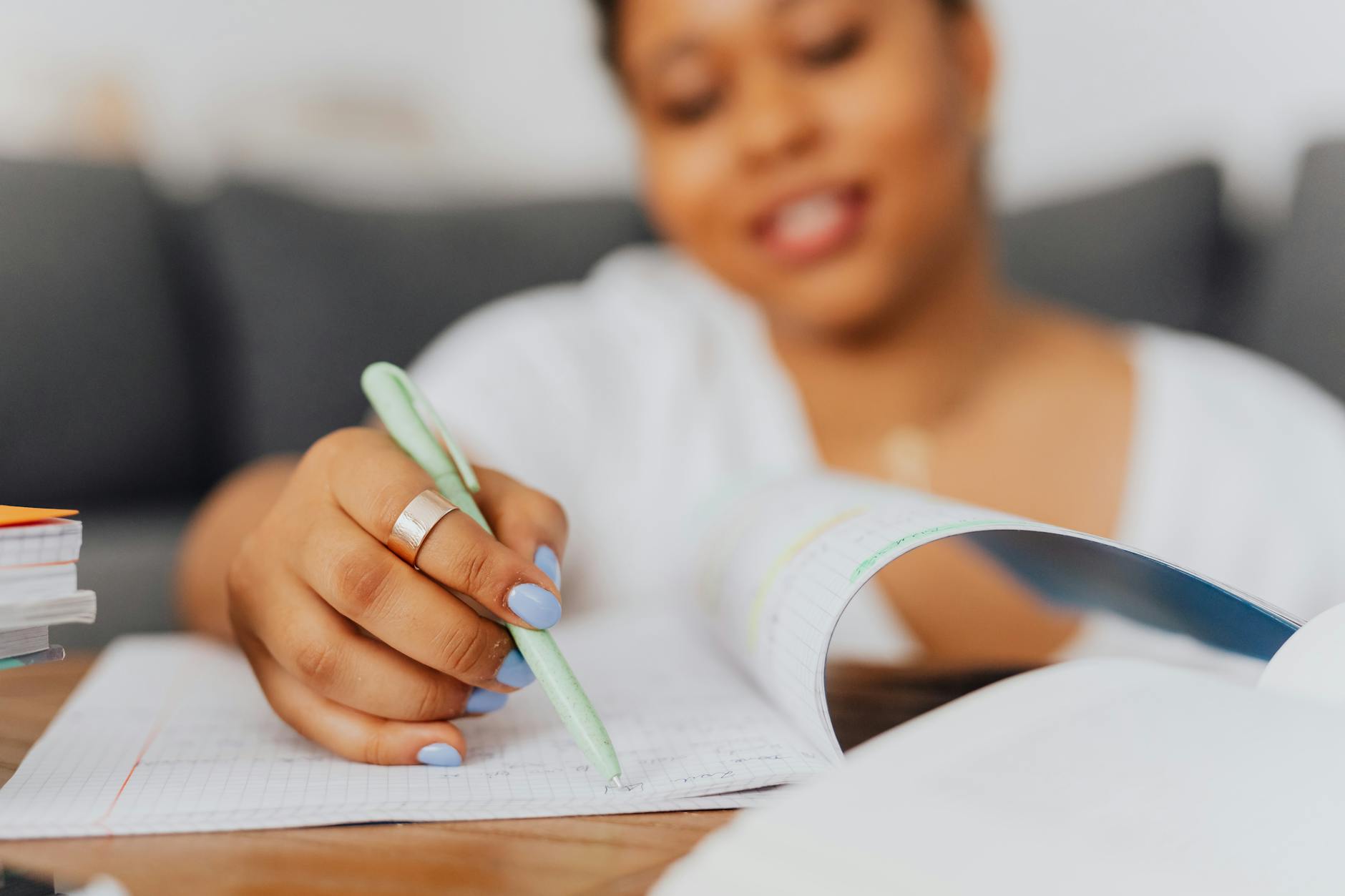 A calm introvert preparing notes before a debate, showcasing a focused expression and organized materials. — debating fo…