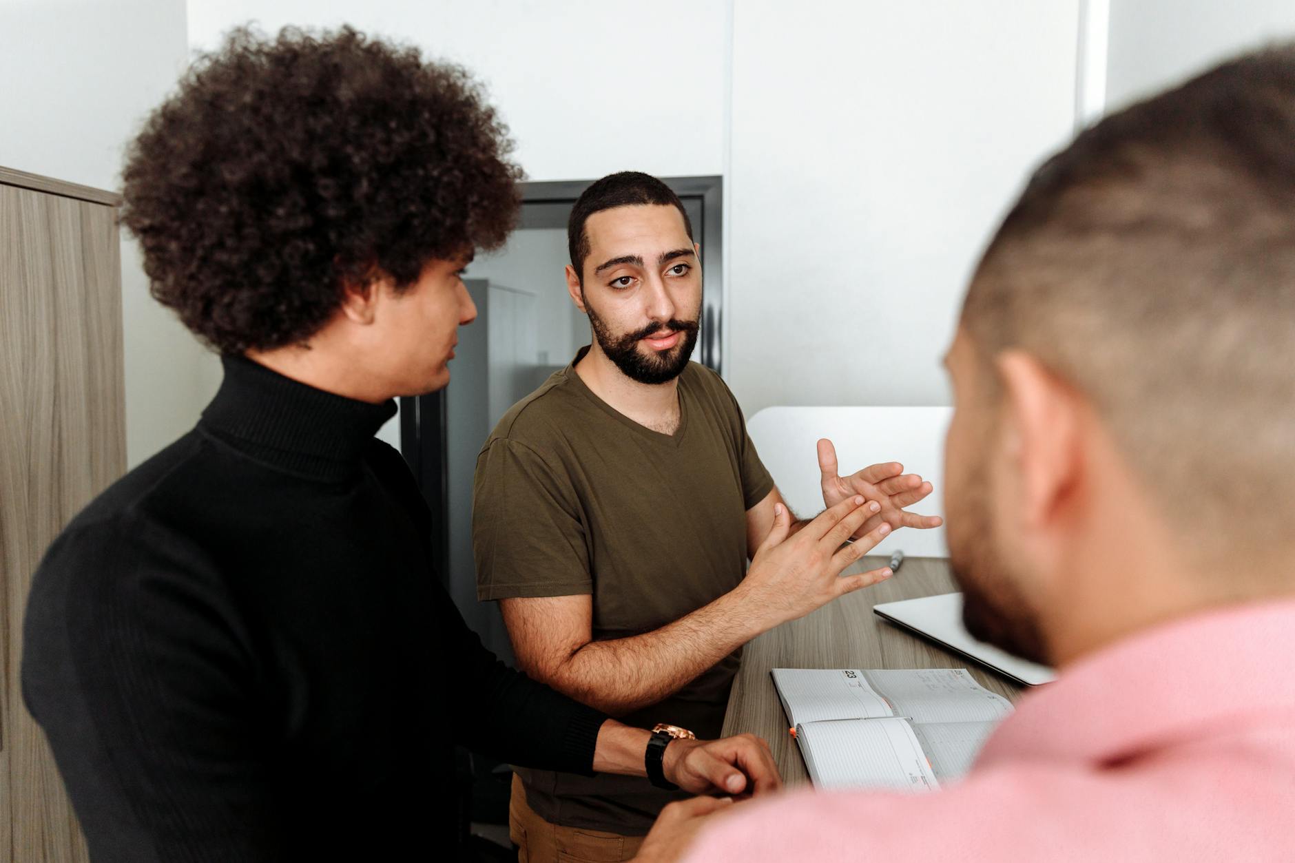 A casual group discussion scene showing people engaged in conversation. — debate vs discussion