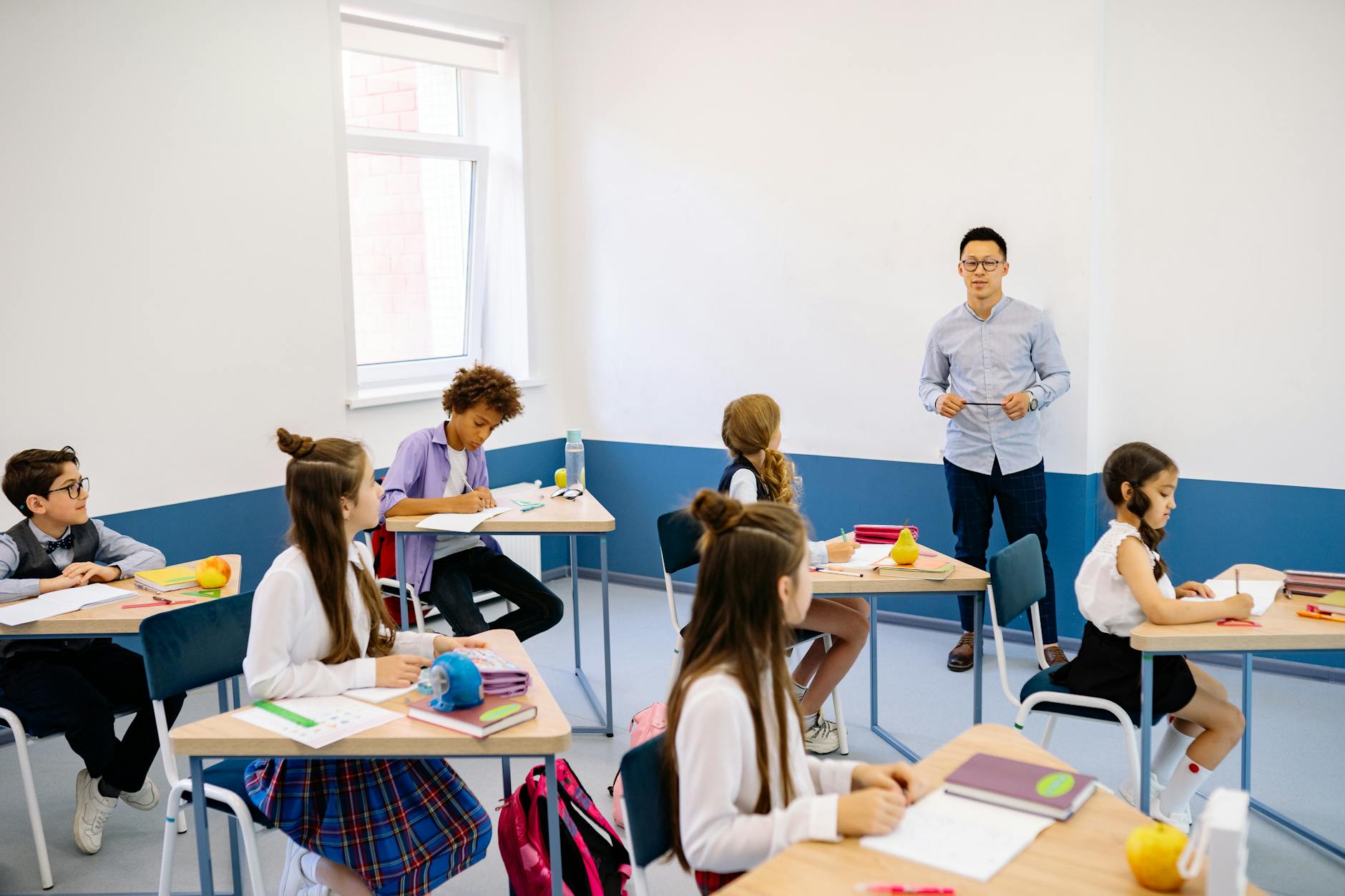 A classroom setting showing students actively engaged in learning. — online vs offline education