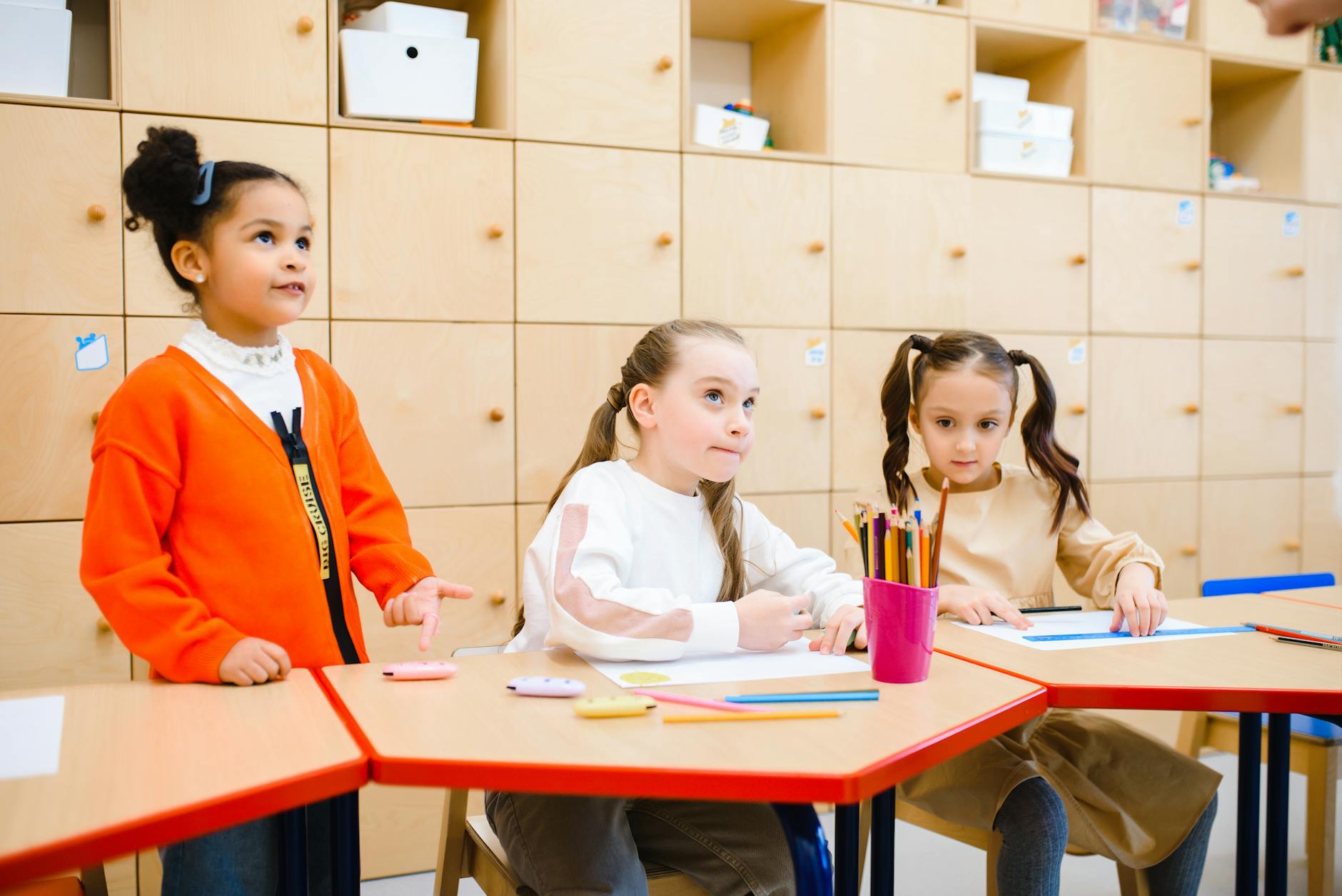 A classroom setting where kids are engaged in a debate activity, showcasing their interaction and teamwork. — debate ski…