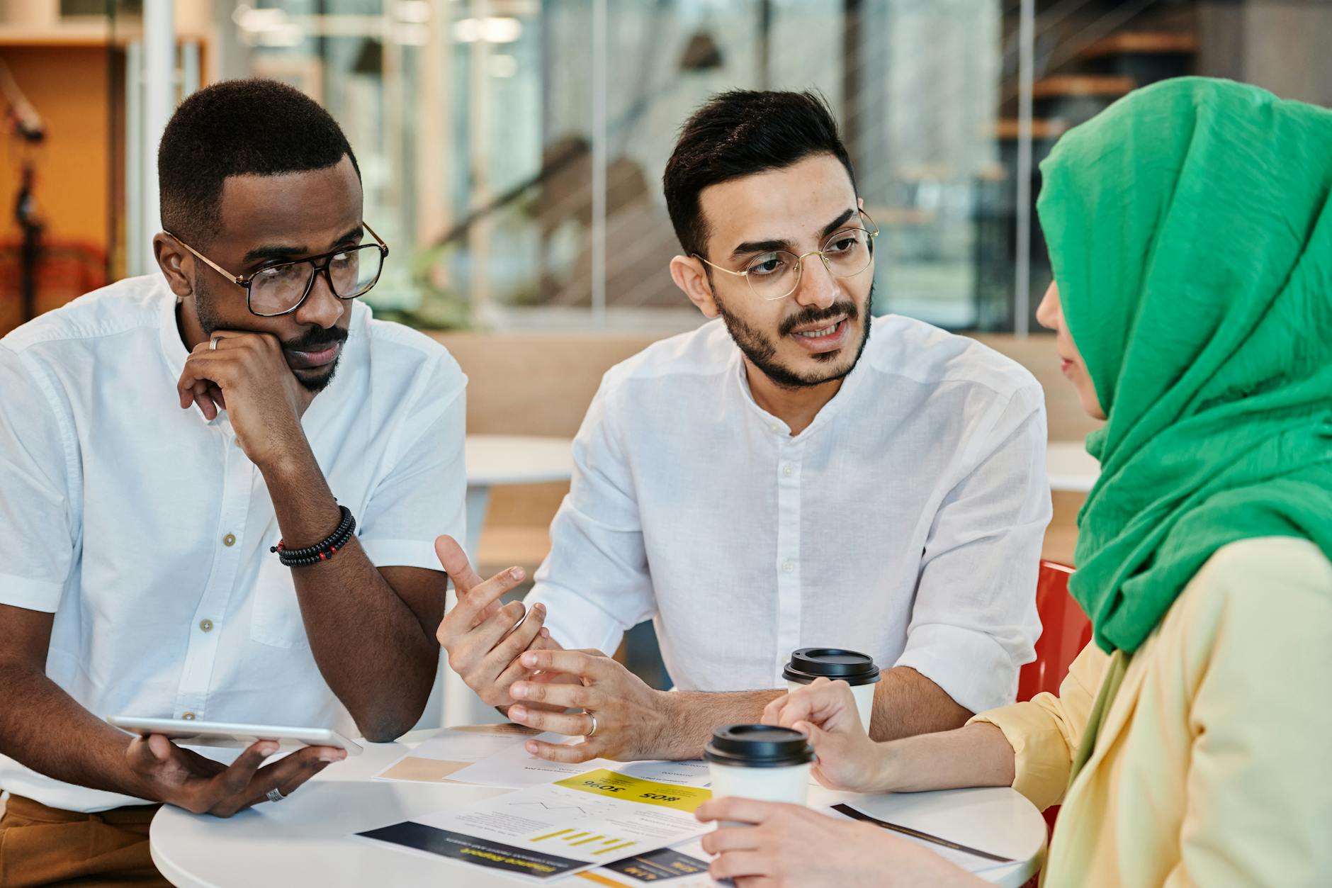 A diverse group of people engaged in a discussion about cultural issues — cultural debates