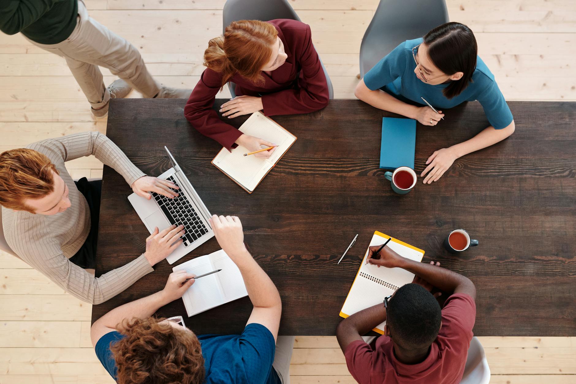 A diverse group of students collaborating on debate strategies, highlighting teamwork and critical thinking. — debate cl…
