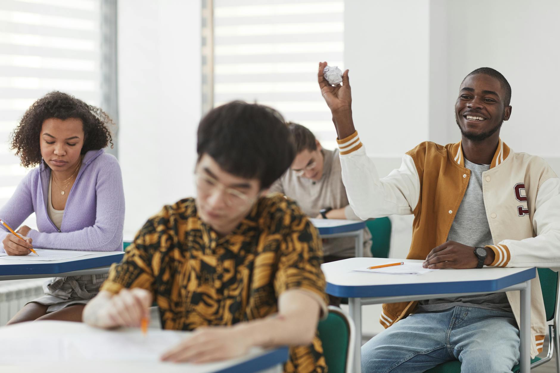 A diverse group of students engaged in a lively debate session. — debate clubs