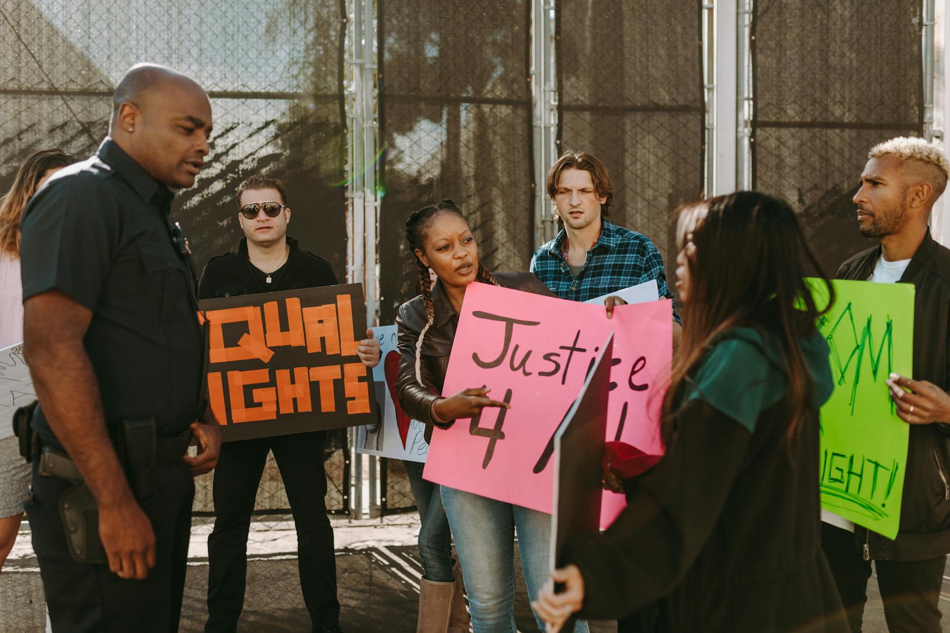 A group of diverse individuals engaged in a debate, showcasing different perspectives on social issues, highlighting the importance of debate for social change.