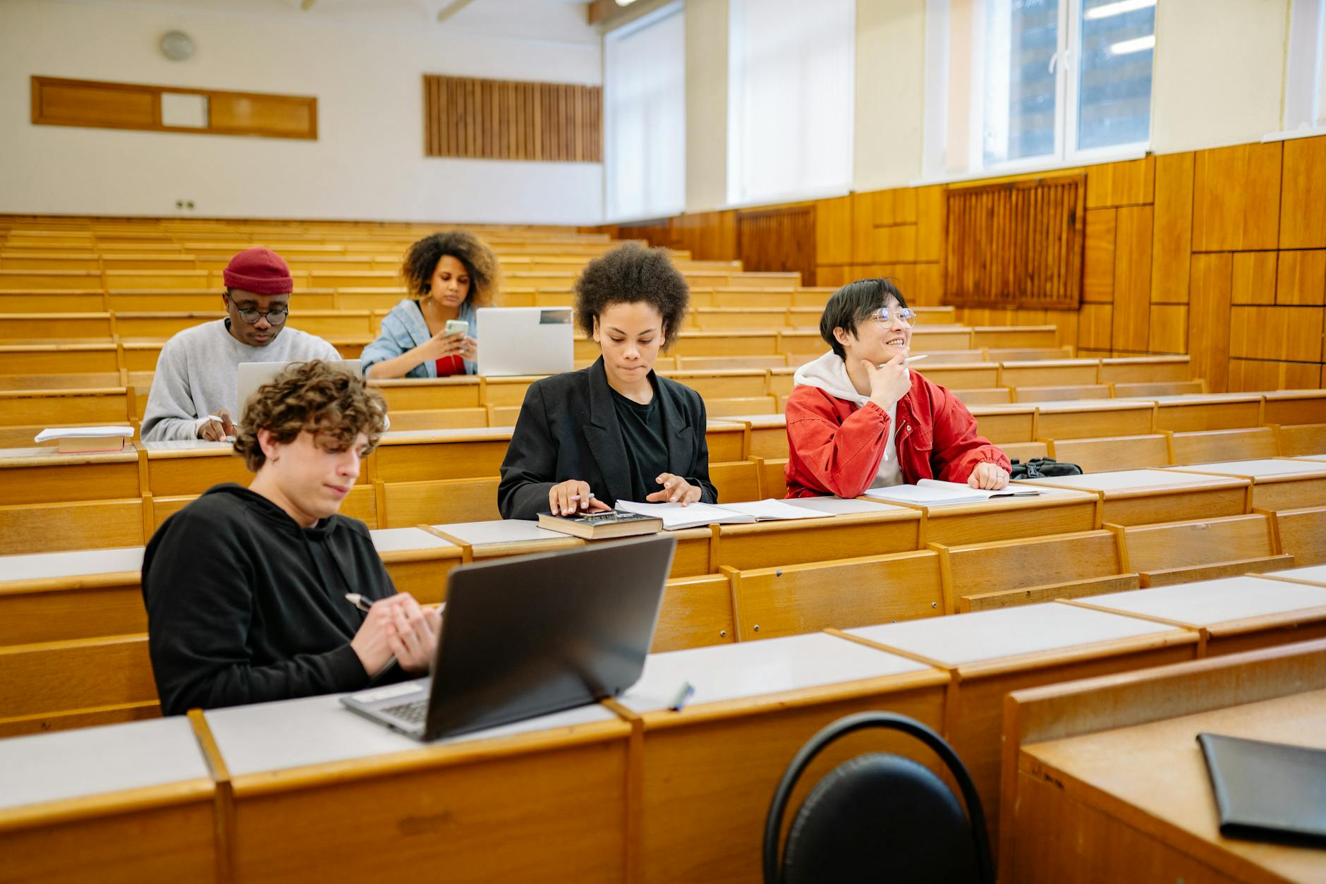 A group of students engaging in a mock debate session, showcasing teamwork and preparation. — debate preparation