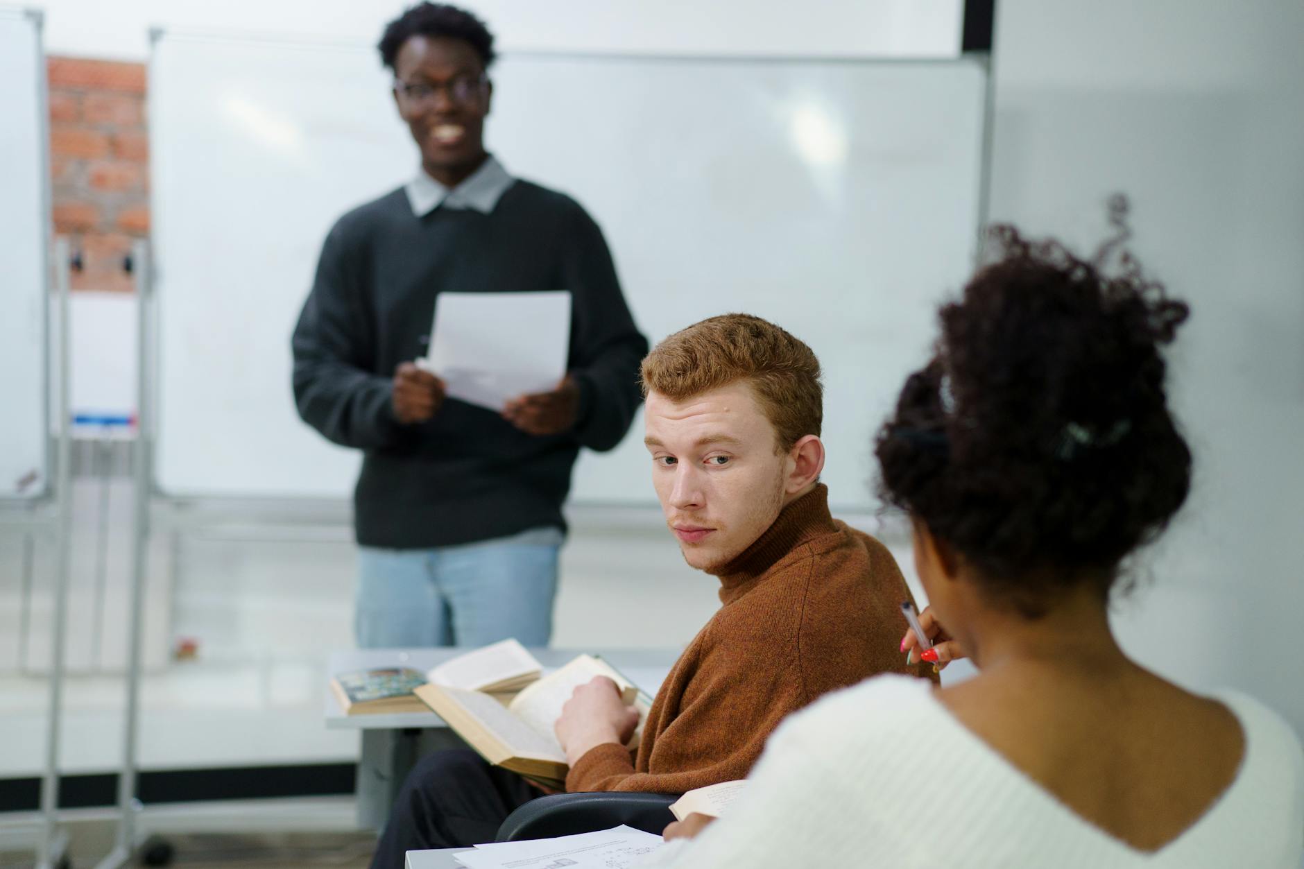 A group of students practicing debate skills in a classroom setting. — debate tournament preparation