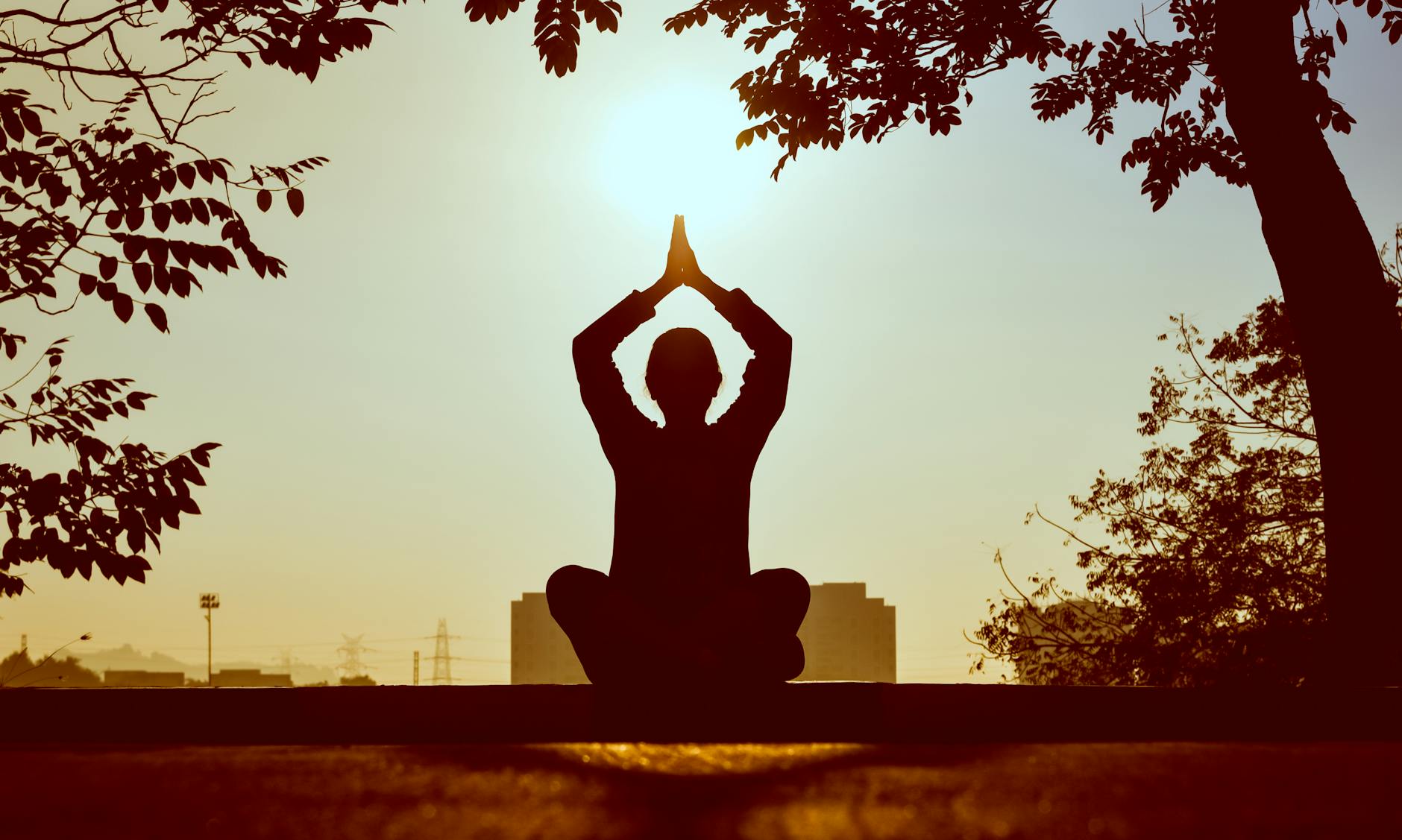 A person meditating in a serene environment, symbolizing mental wellbeing and happiness. — money vs happiness debate
