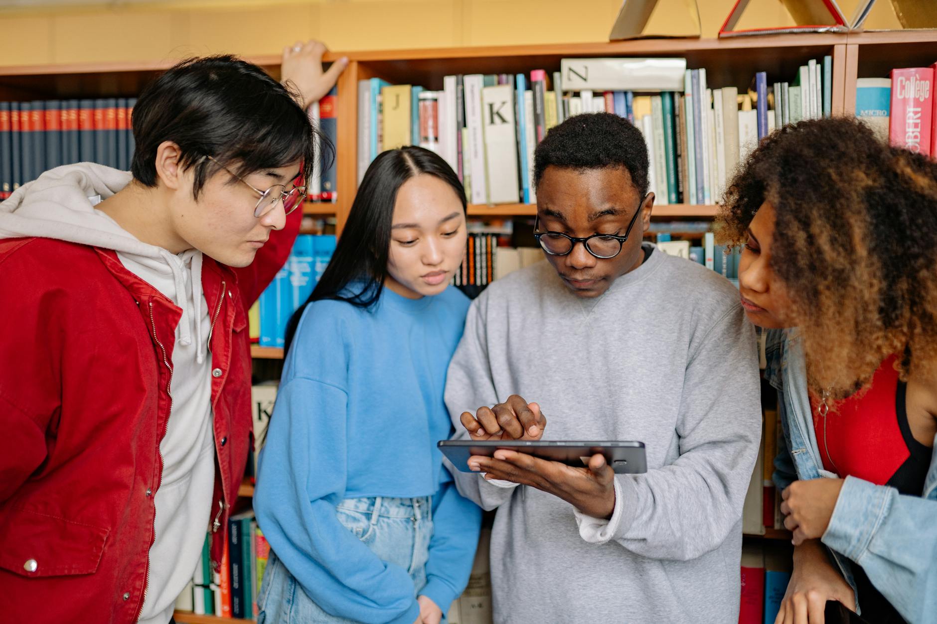 A photo of a diverse group of students engaged in a debate using digital tools. — future of debating