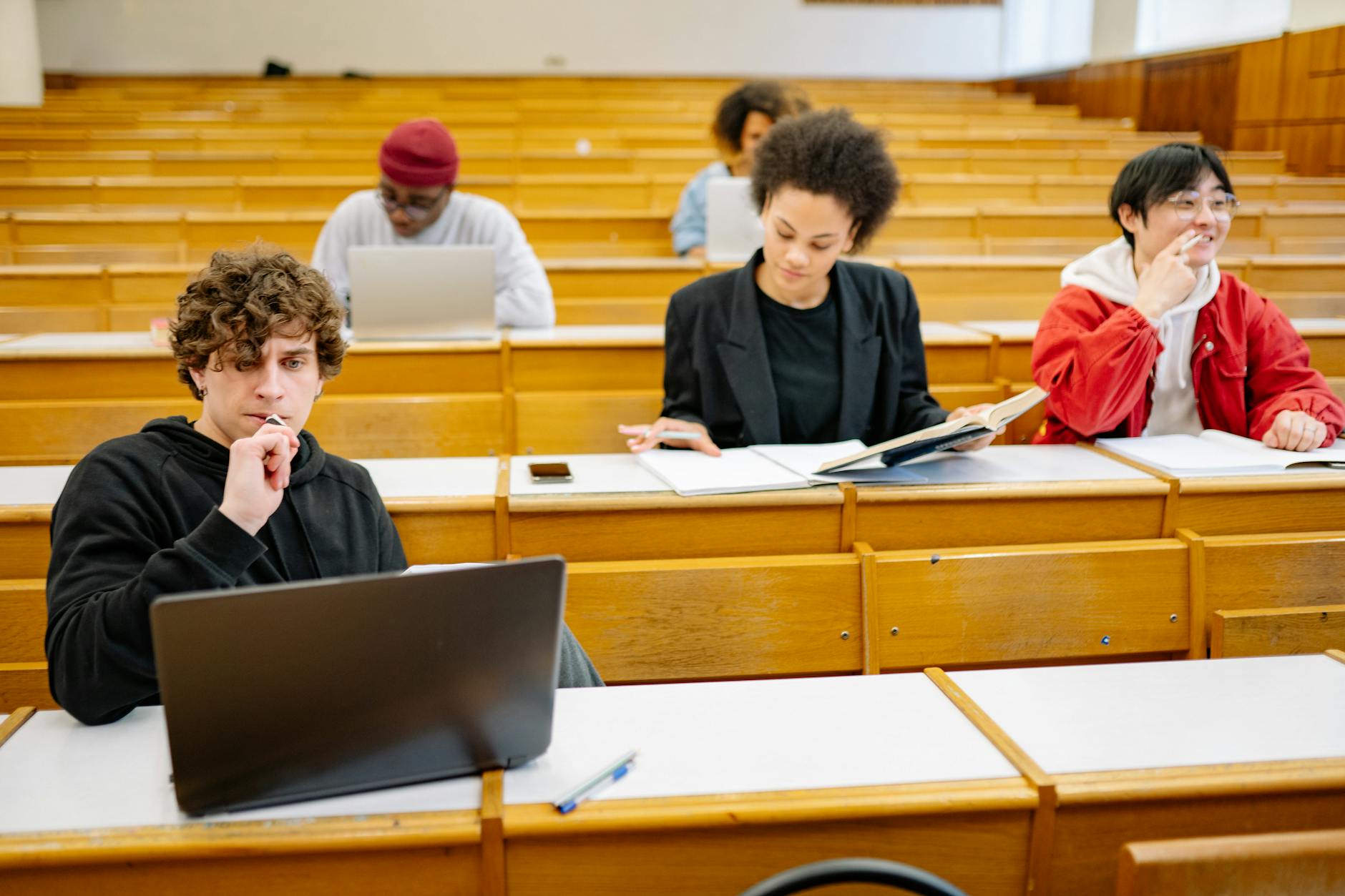 A photo of a diverse group of students in a college classroom setting — free college education