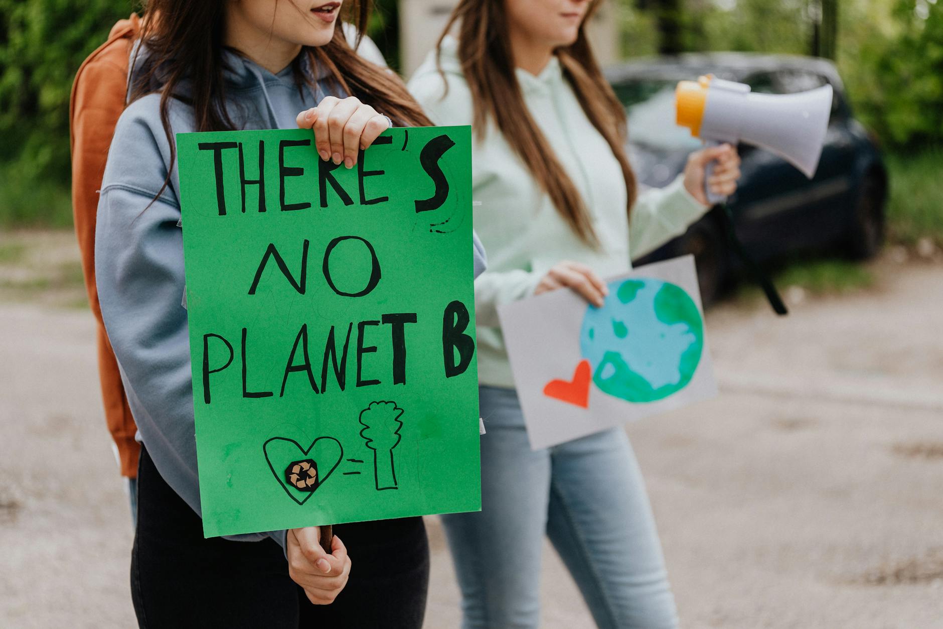 A photo of a protest advocating for climate action. — climate change debate