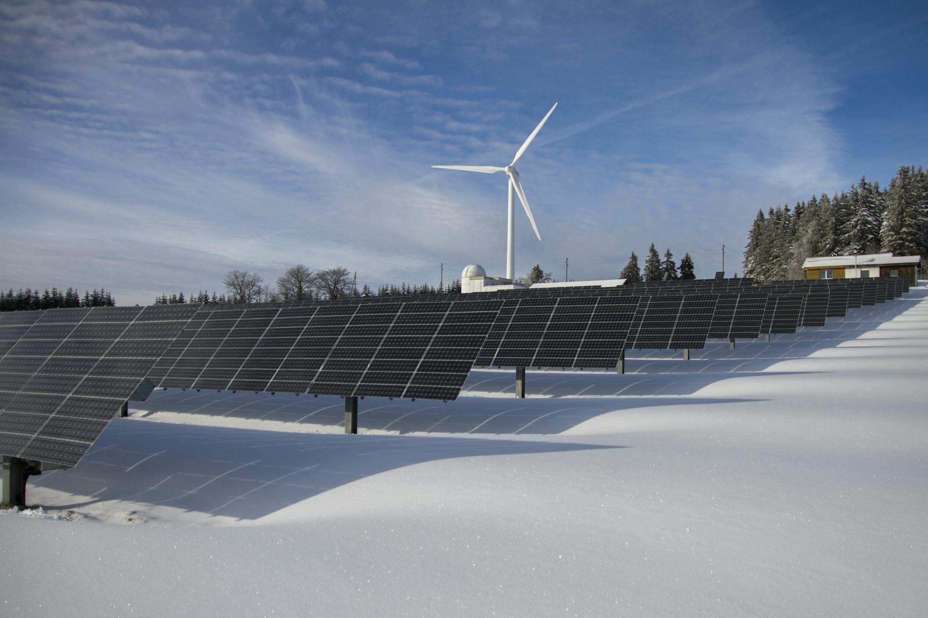 A photo of a renewable energy installation, such as solar panels or wind turbines, highlighting climate change action.