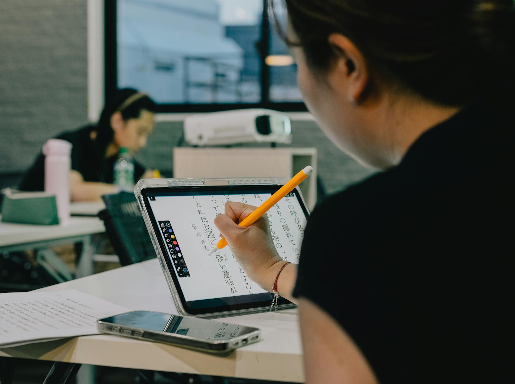A photo of students using technology in a classroom setting. — technology impact on intelligence