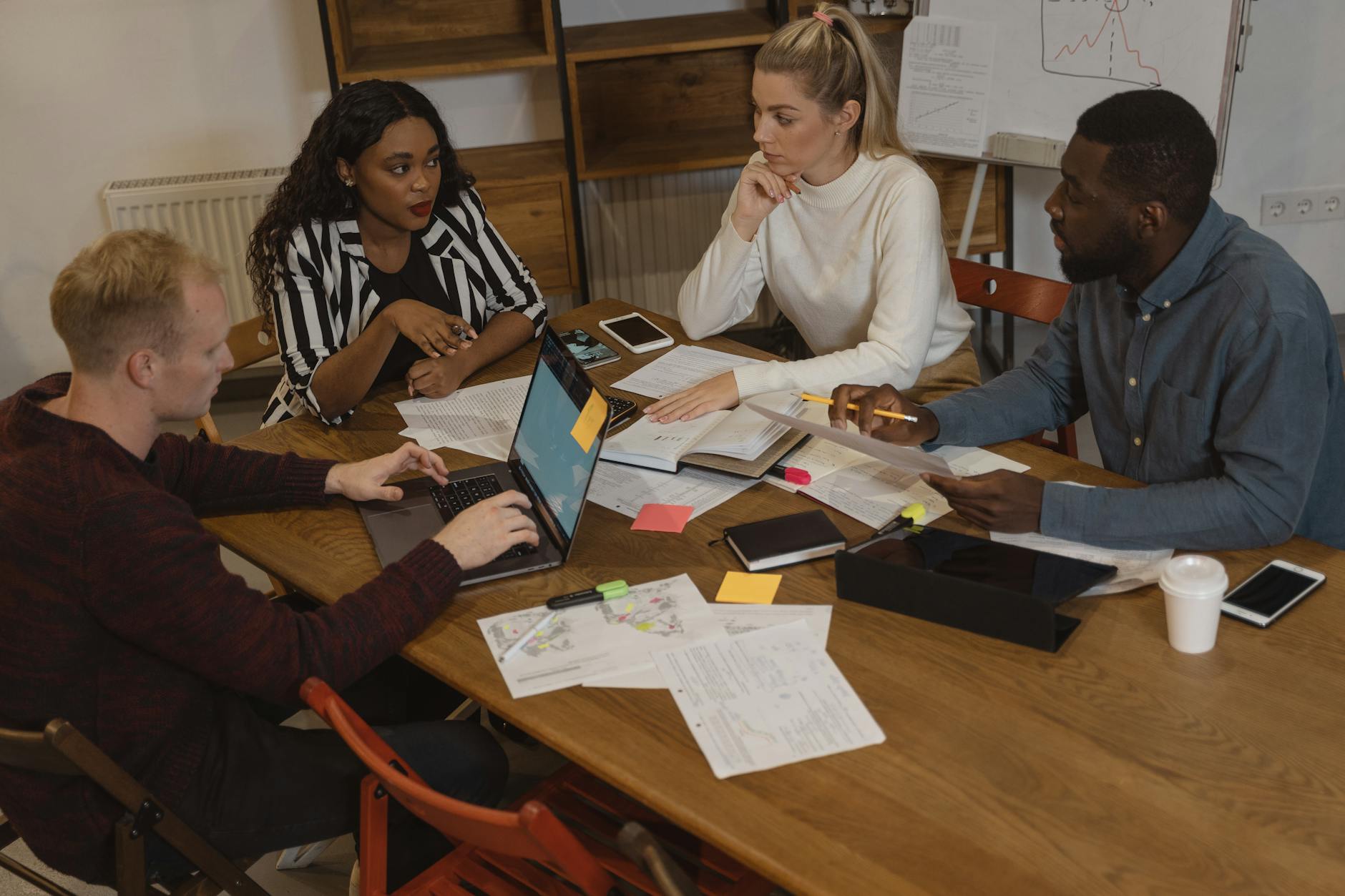 A photograph of a community meeting discussing universal basic income initiatives.