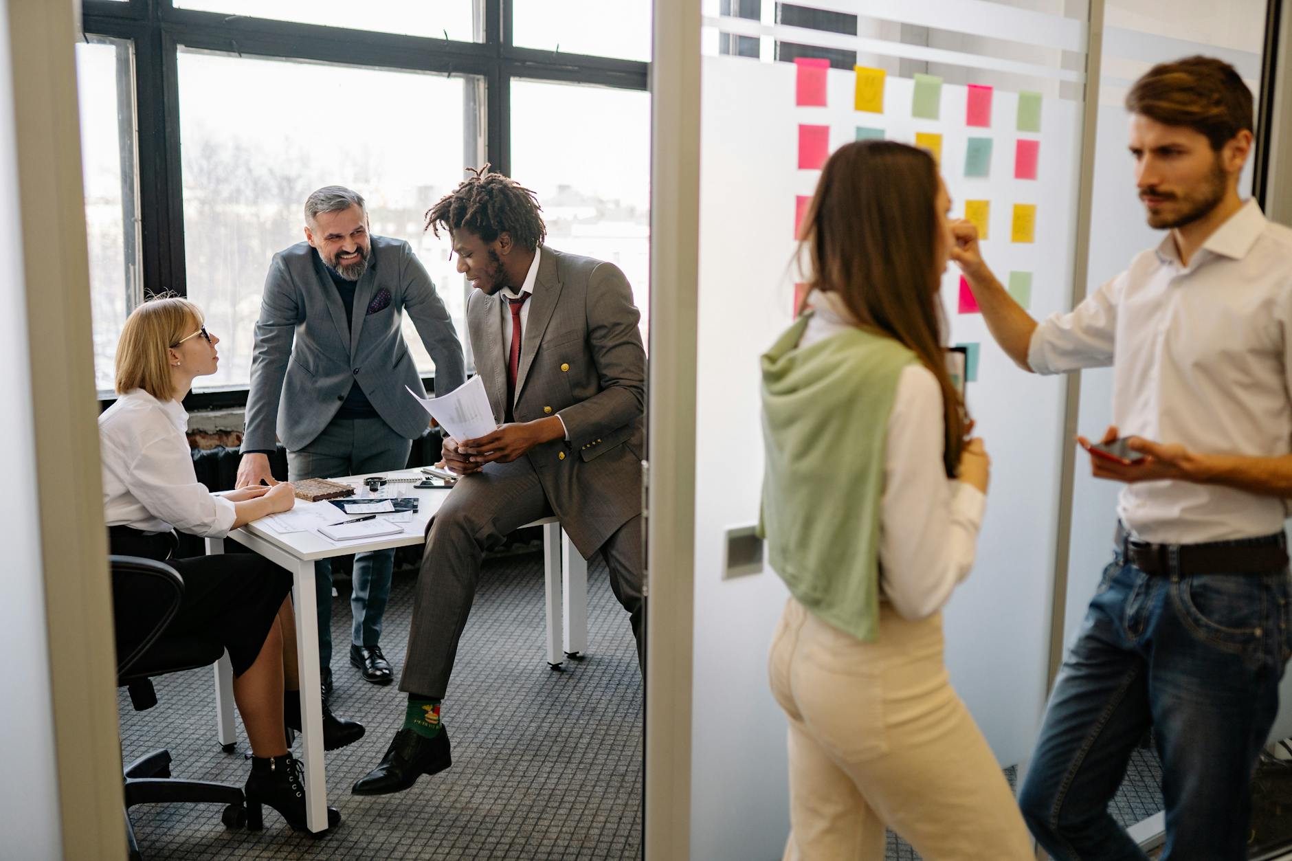 A role-playing scenario showing colleagues practicing rebuttal responses in a team setting. — handling rebuttals
