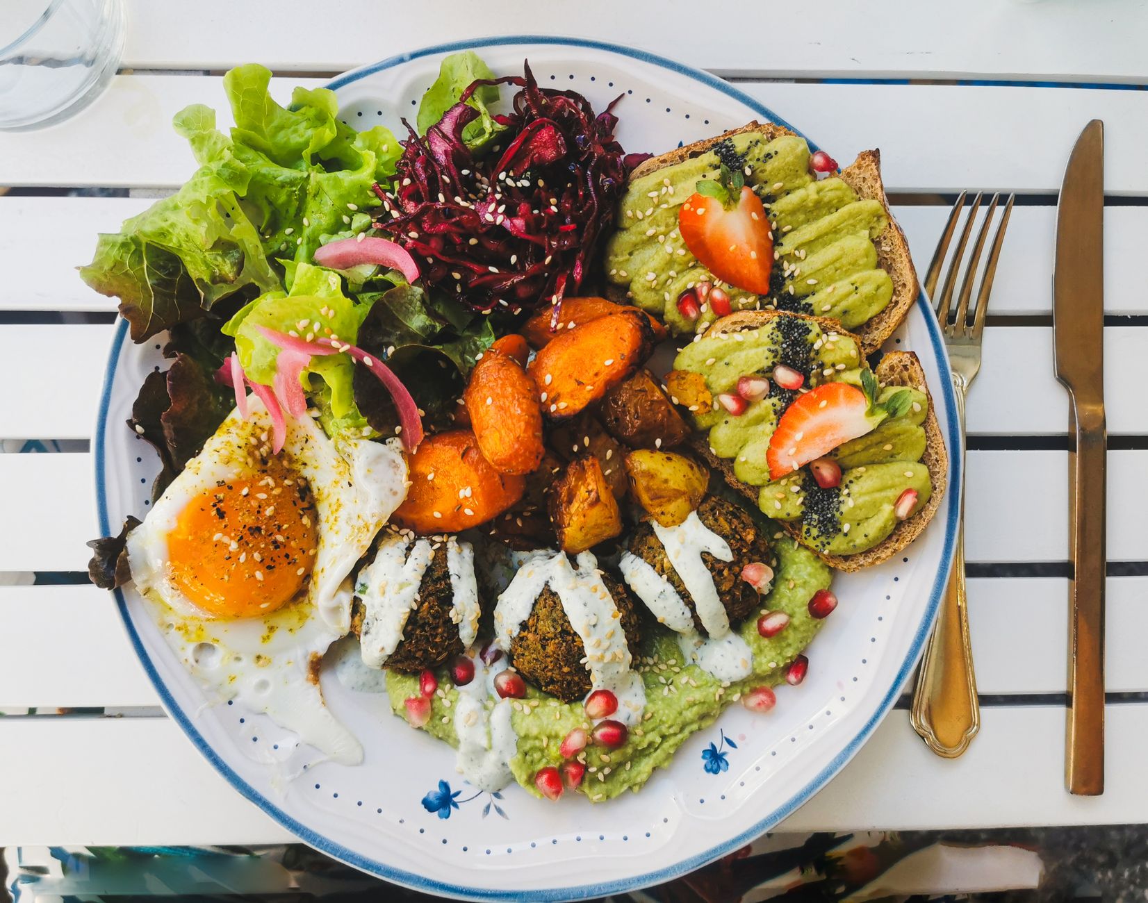 A vibrant plate of various plant-based foods, highlighting the diversity of vegan cuisine. — veganism