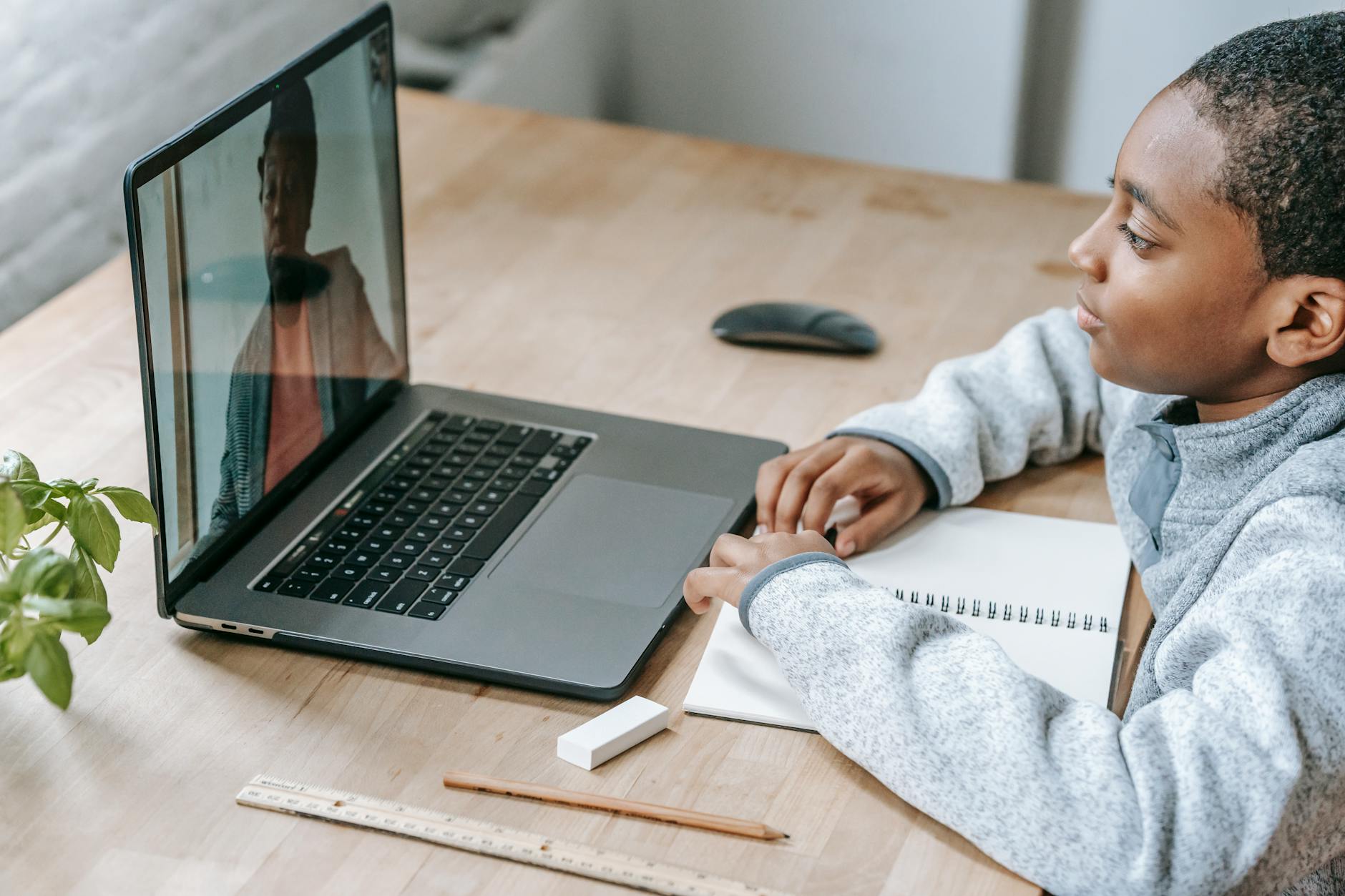 An e-learning setup featuring a student using a laptop with digital learning tools. — online vs offline education