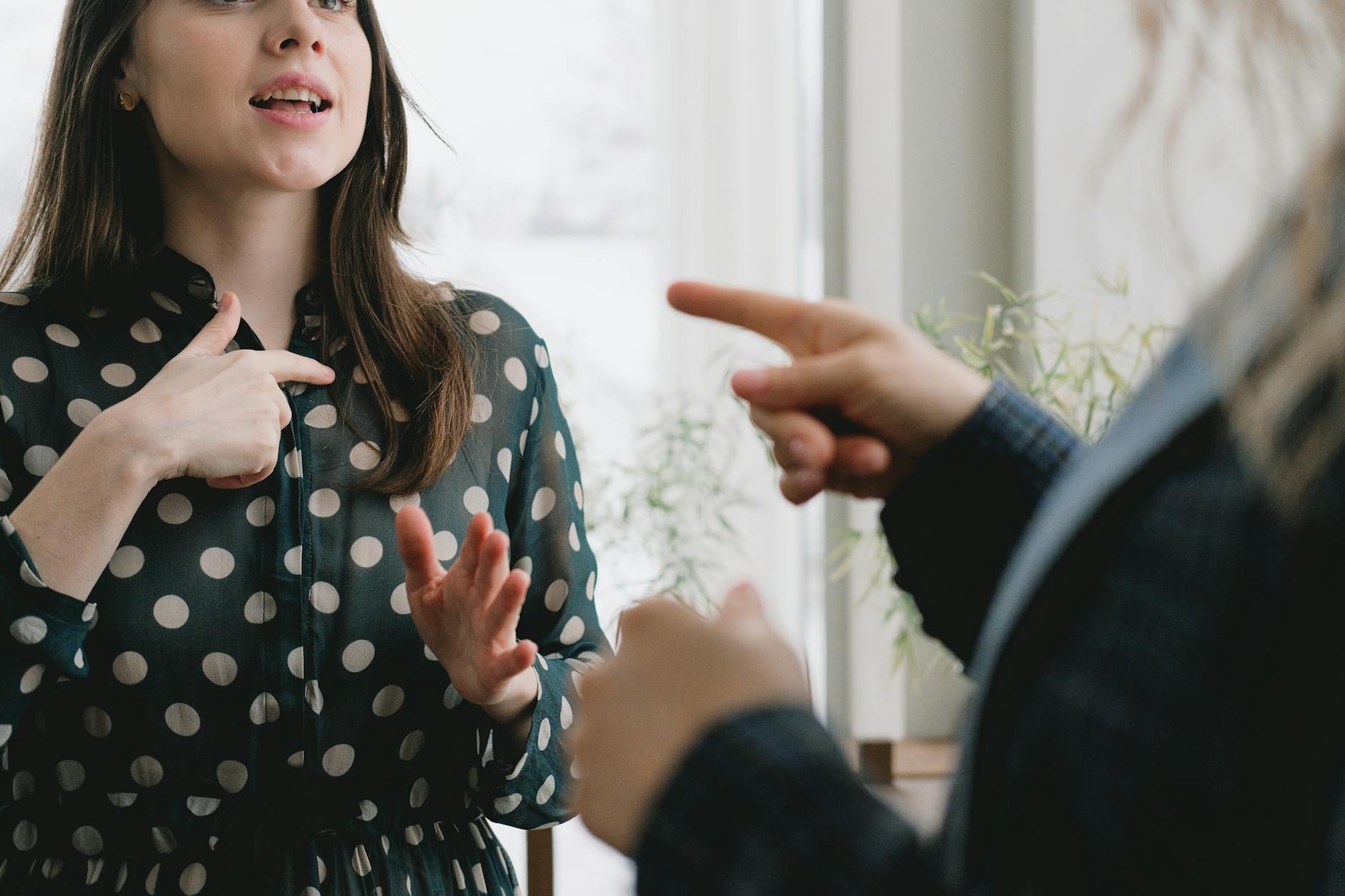 An image demonstrating effective body language during a debate with a debater using gestures confidently. — nonverbal co…