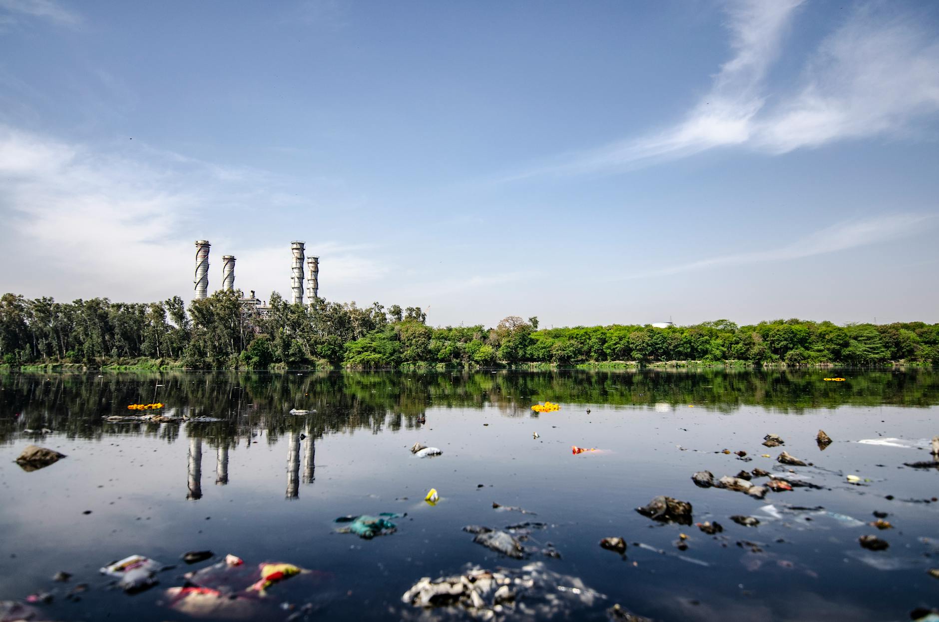 An image depicting polluted water sources near textile factories. — fast fashion impact