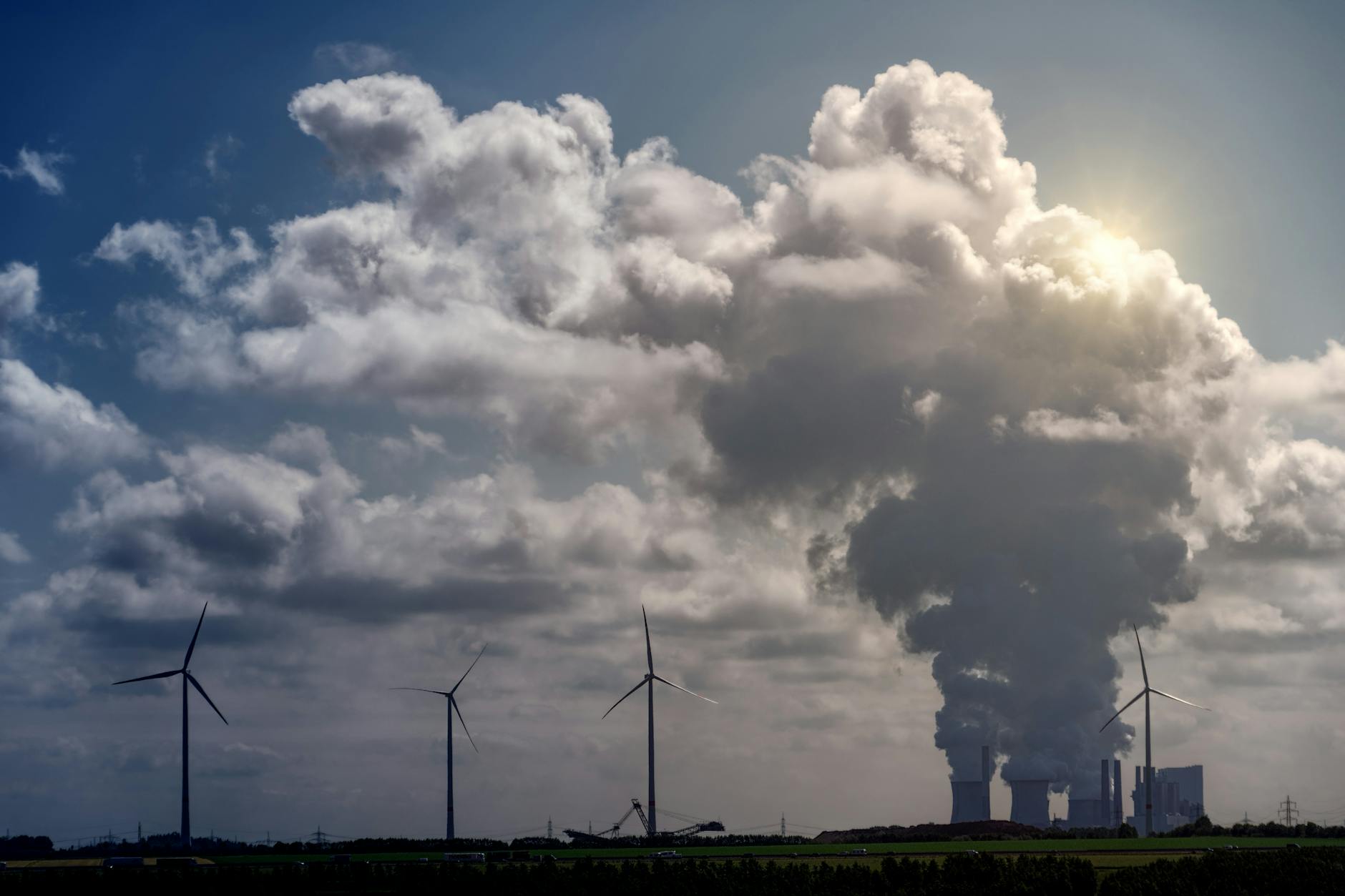 An infographic comparing carbon emissions from fossil fuels versus renewable sources. — climate change debate