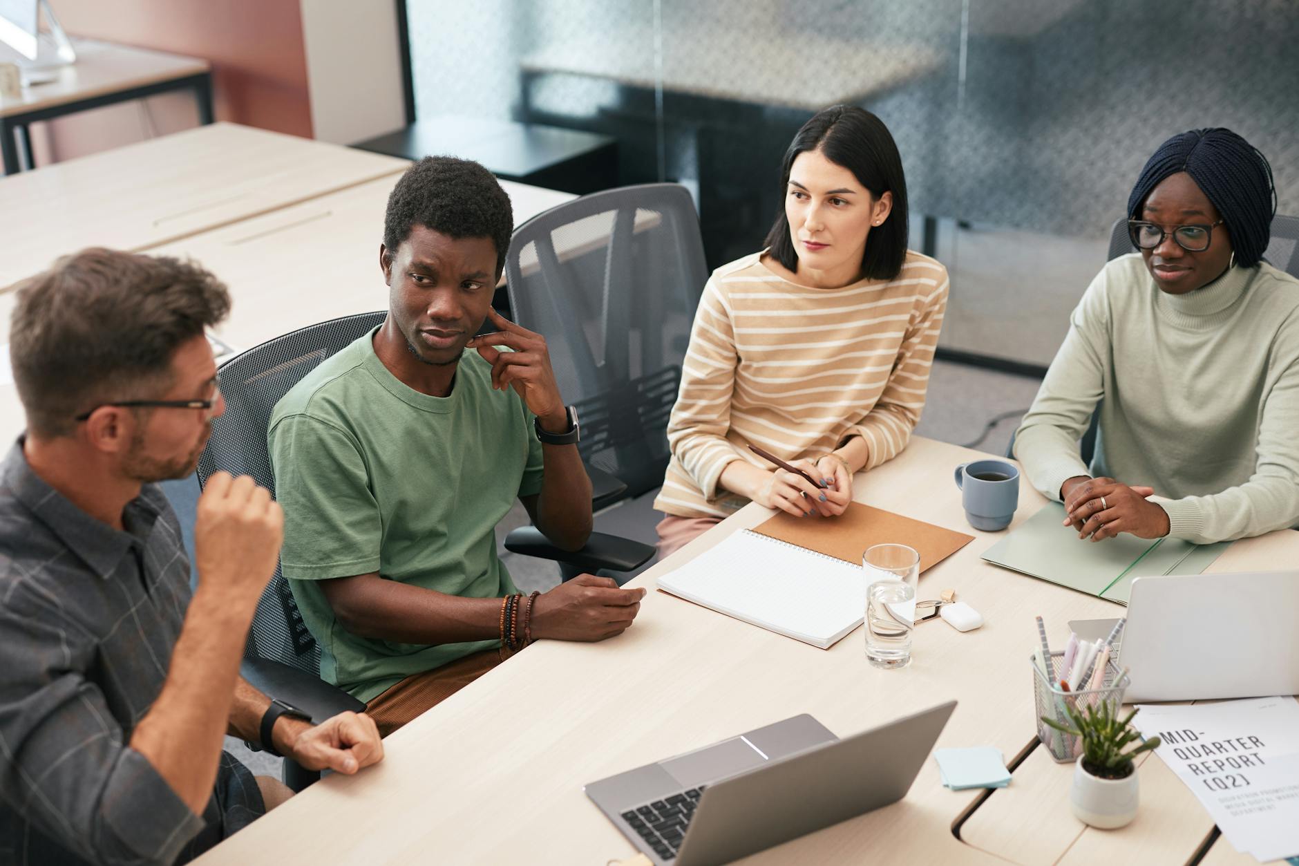an image depicting a diverse group engaged in a debate, highlighting active listening — listening skills