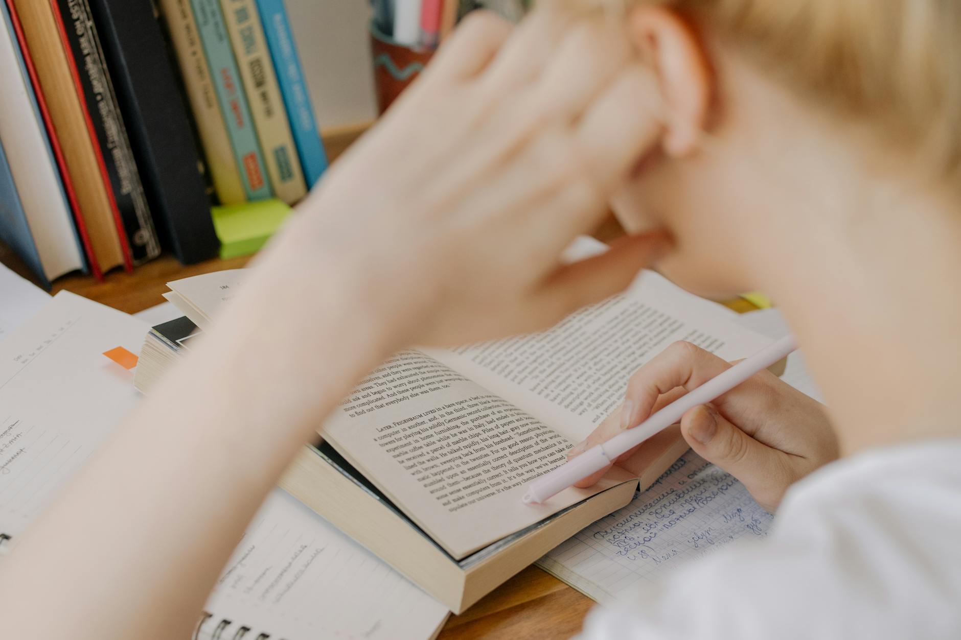 A calm and focused introvert preparing for a debate at a desk, with notes and books around. — debate for introverts