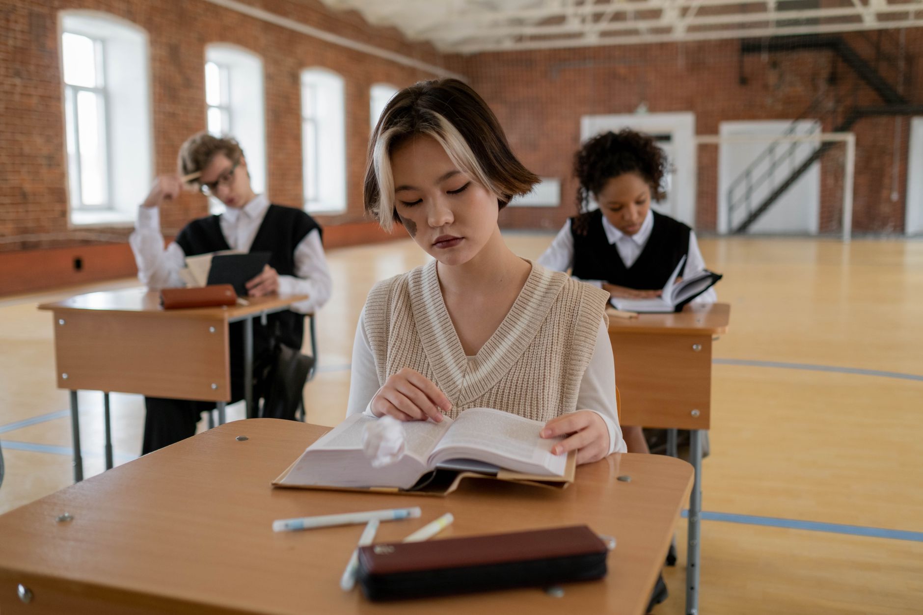 A classroom filled with diverse students representing various socioeconomic backgrounds. — free college education