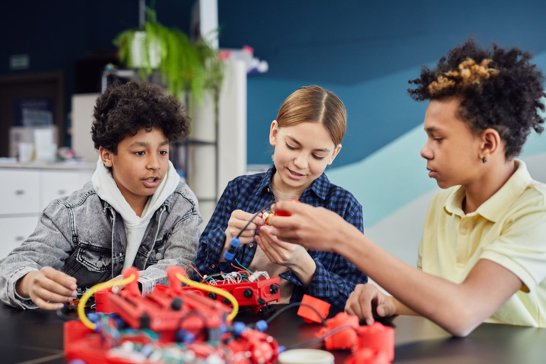 A classroom scene showing students engaged in a project-based learning activity, highlighting creativity and collaboration…