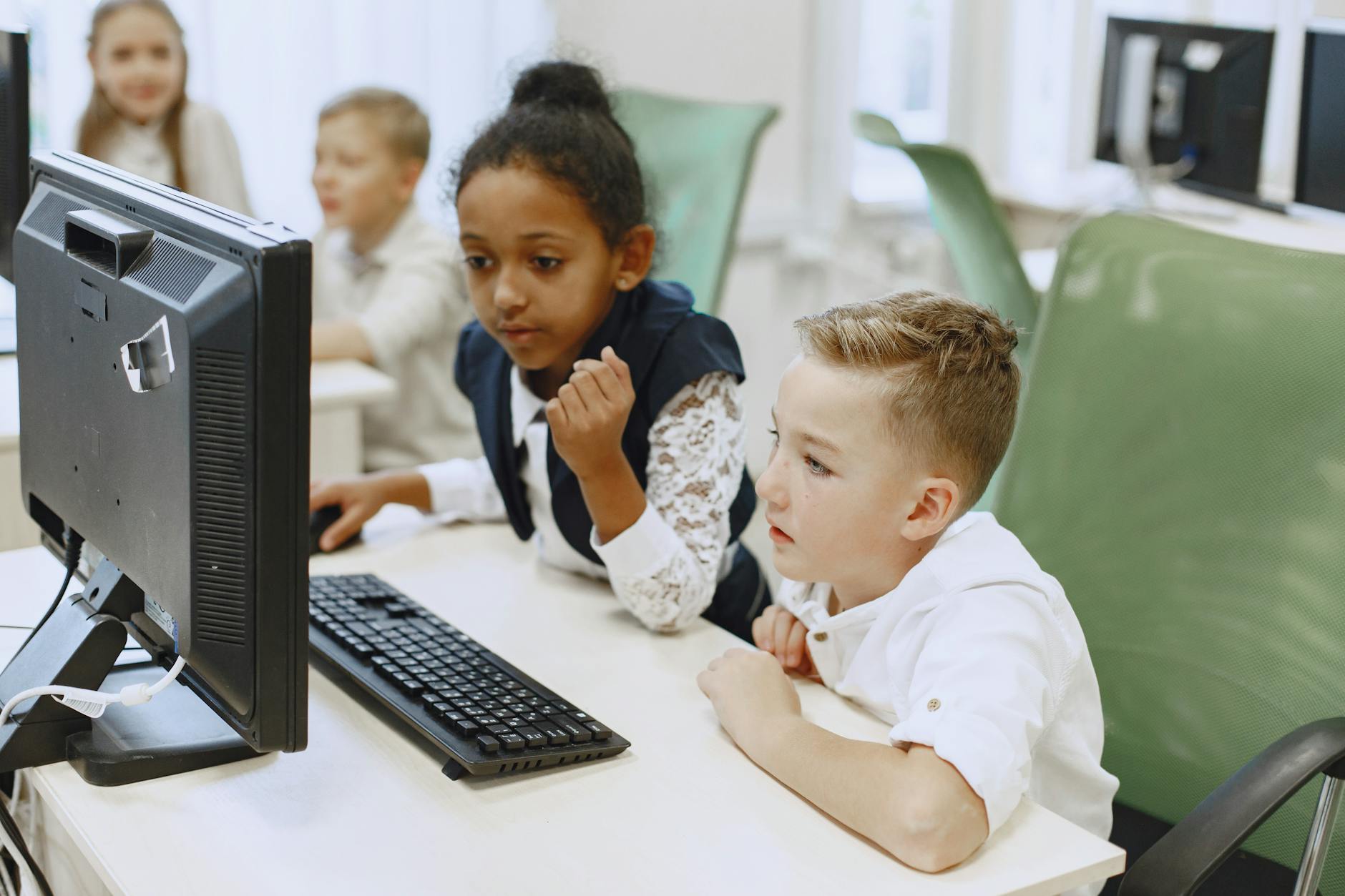 A classroom setting where students interact with AI learning tools, showcasing the integration of technology in education.…