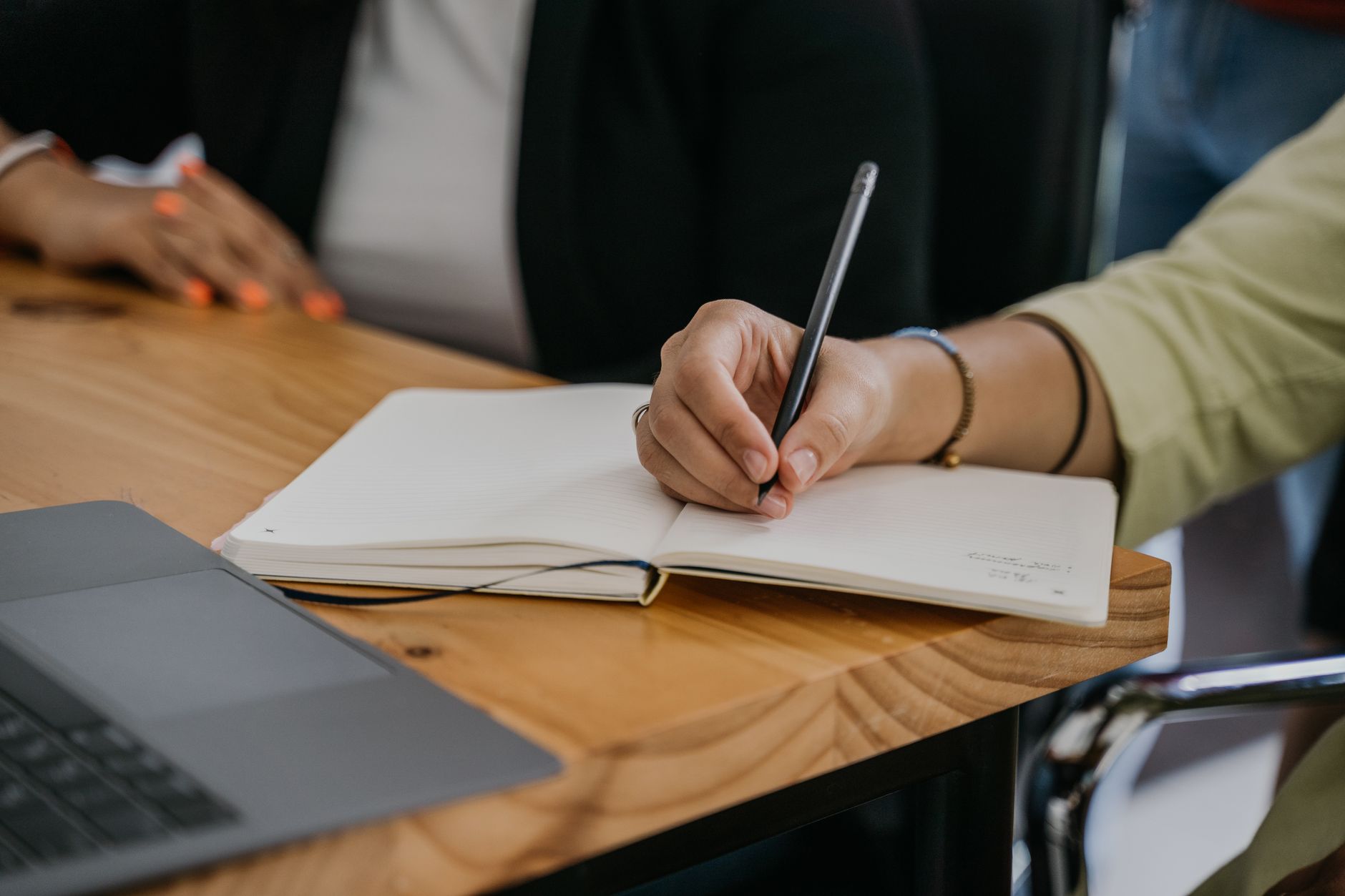 A close-up of a debate preparation session with notes and laptops. — clever debate topics