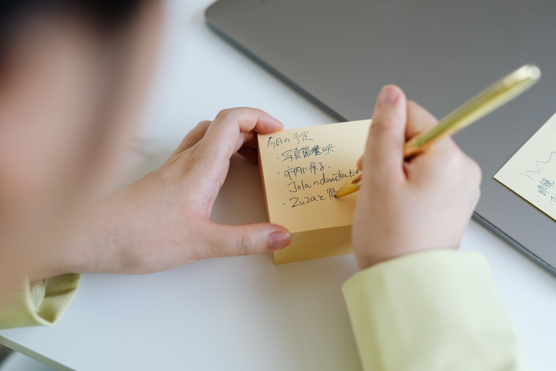 A close-up of a notepad with key points and counterarguments written down, emphasizing organization in debate preparation.