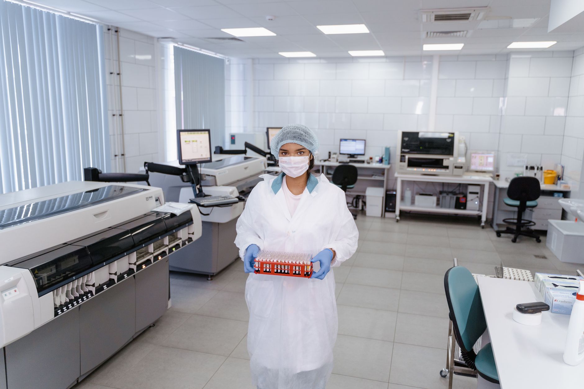 A conceptual image showing a scientist working with genetic material in a lab to discuss genetic engineering ethics.