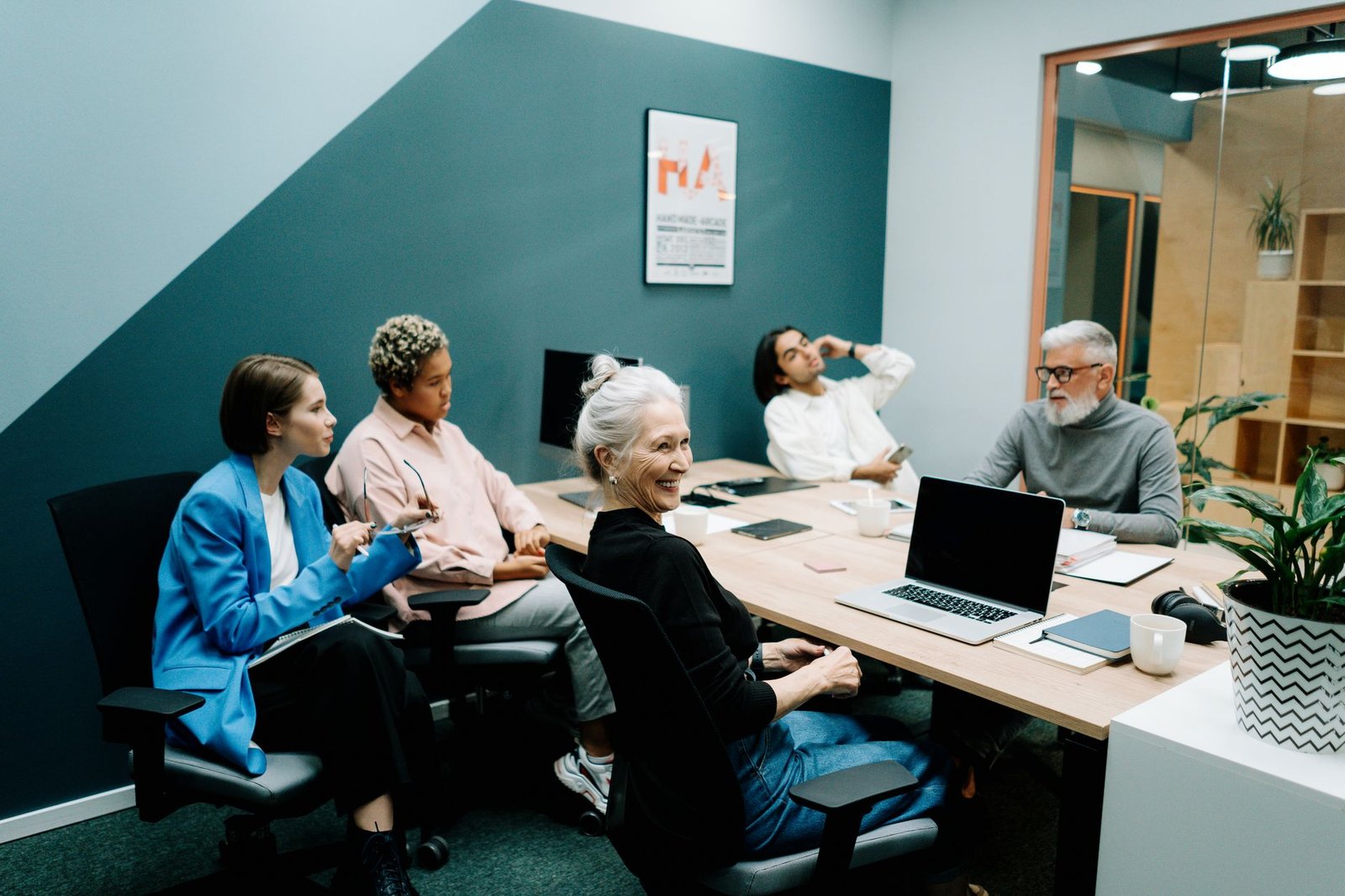 A diverse group of people discussing AI ethics at a roundtable, representing various perspectives. — AI ethics debate