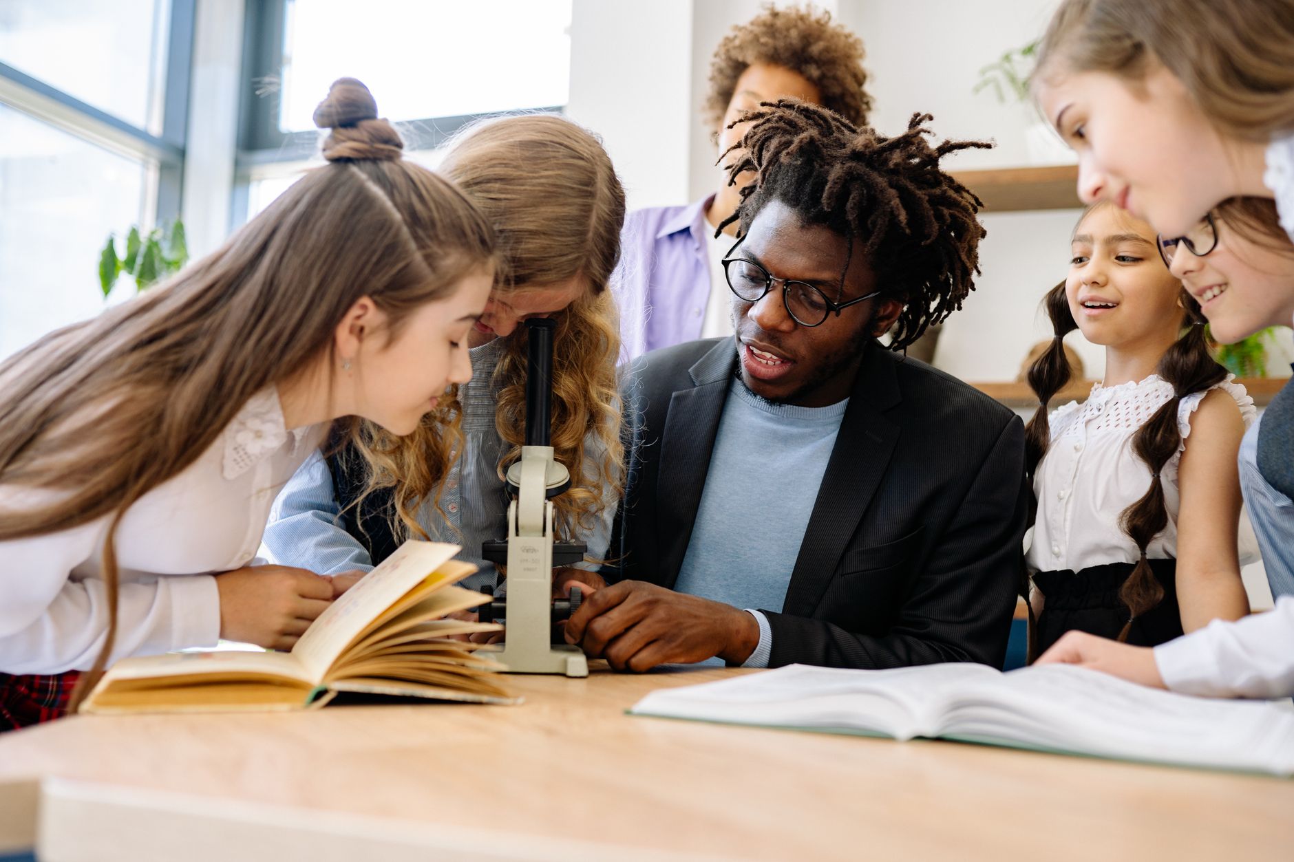 A diverse group of teachers collaborating on education reform strategies — education reform debate