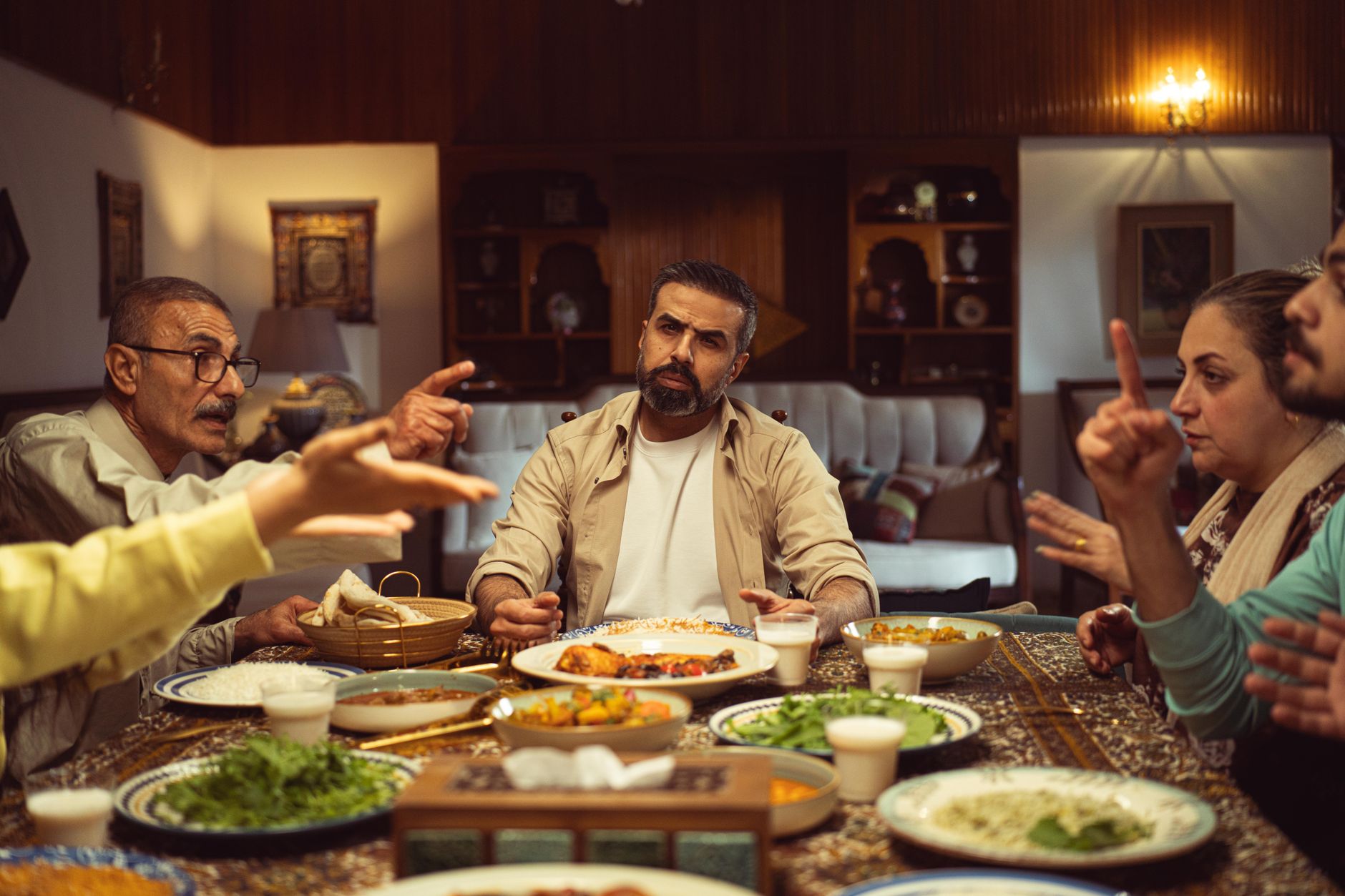 A family discussing smartphone usage at the dinner table, emphasizing communication. — kids smartphone debate