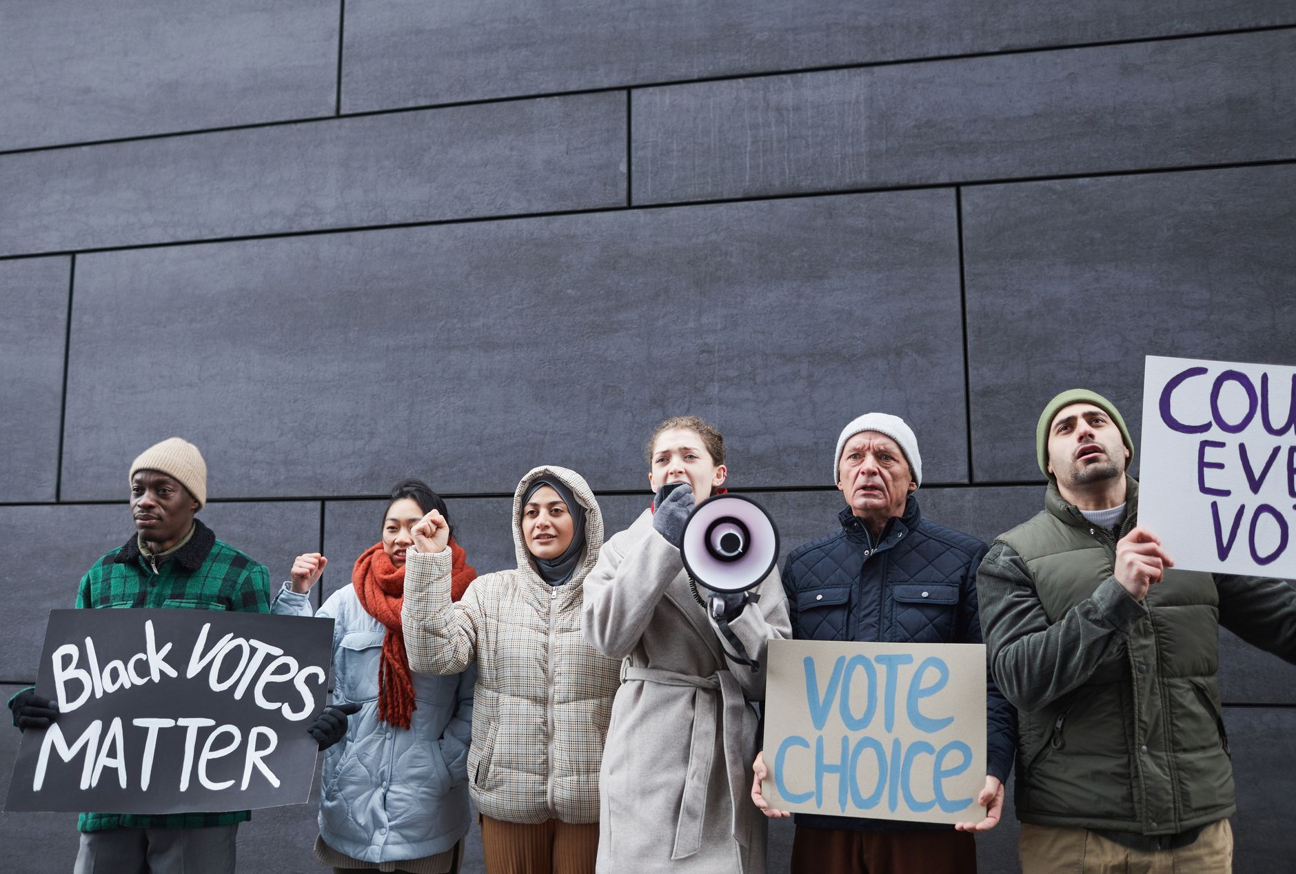 A group of diverse citizens engaging in a community dialogue on political issues — political polarization debate