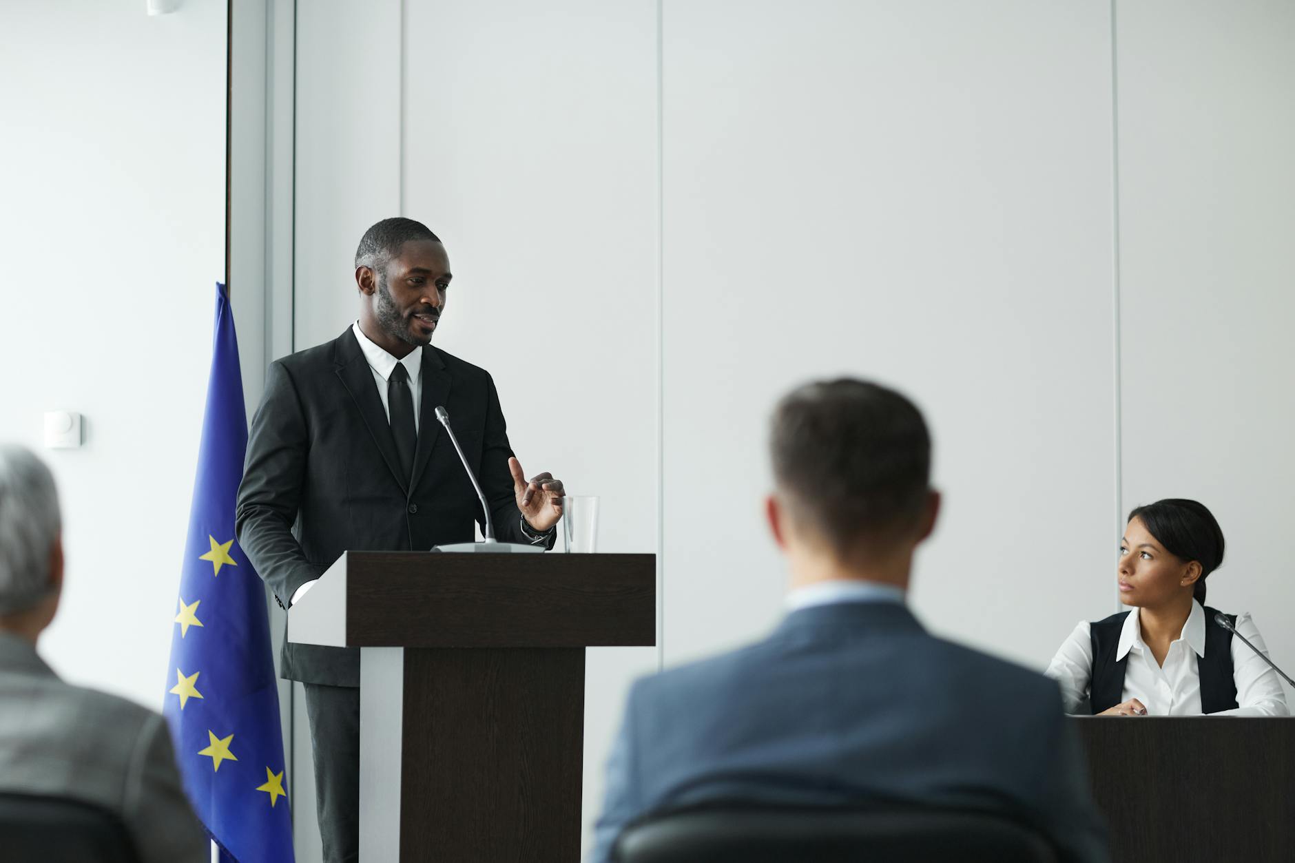 A moderator guiding a panel discussion, emphasizing the importance of inclusivity in debates. — diverse perspectives in …