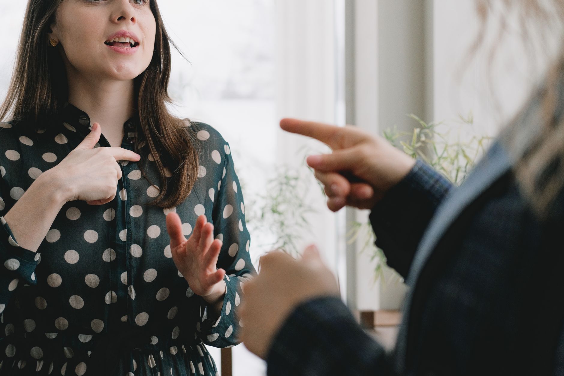 A person practicing their debate delivery in front of a mirror, showcasing body language and gestures. — debate preparat…