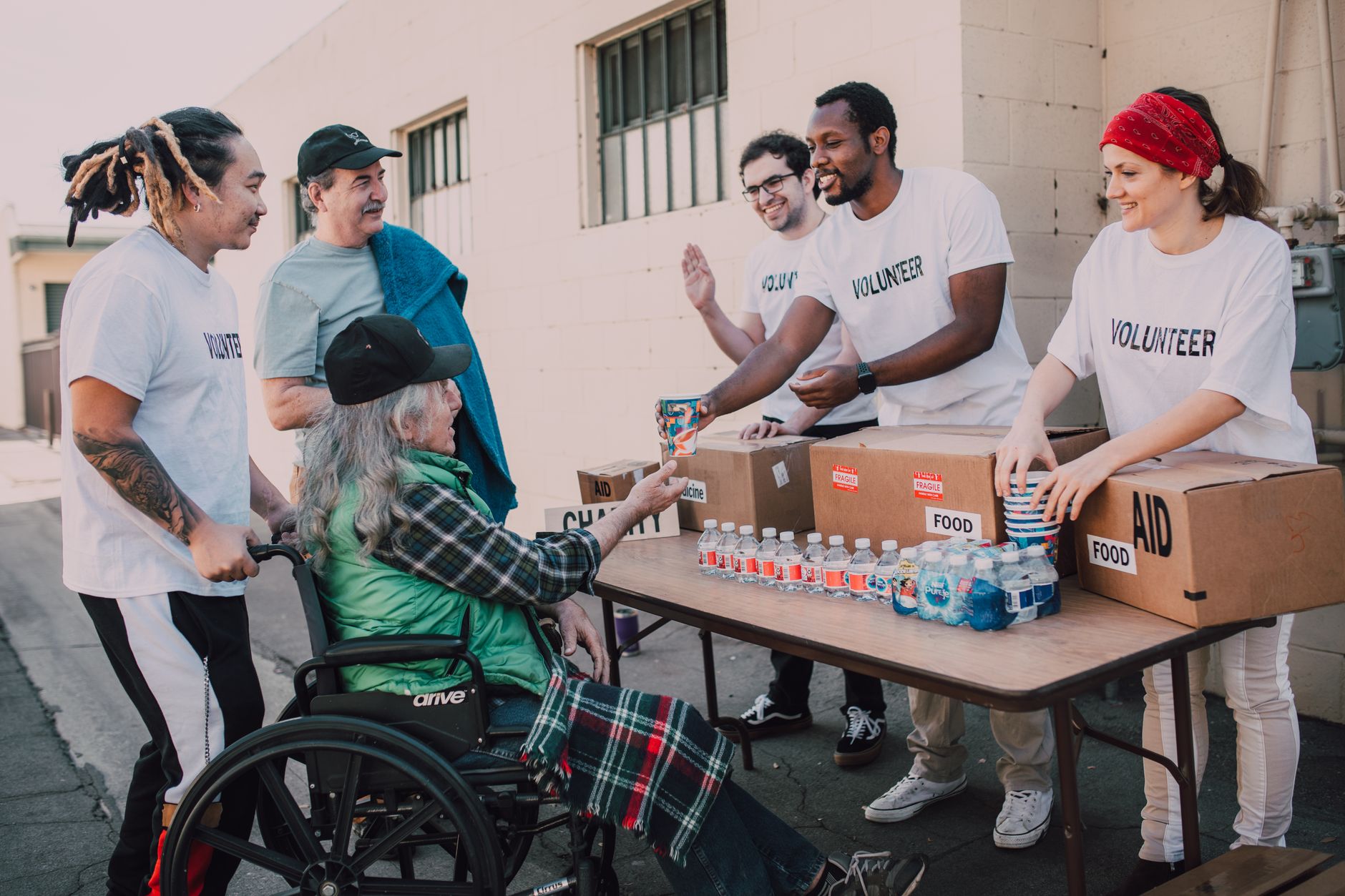 A photo of a billionaire philanthropist at a charity event, highlighting their social contributions. — billionaires debate