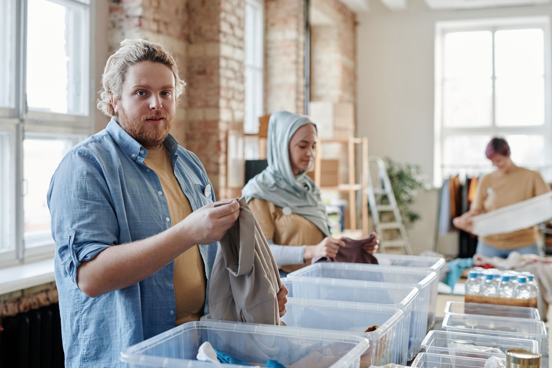 A photo of a clothing recycling event, showcasing community efforts to combat the fast fashion impact.