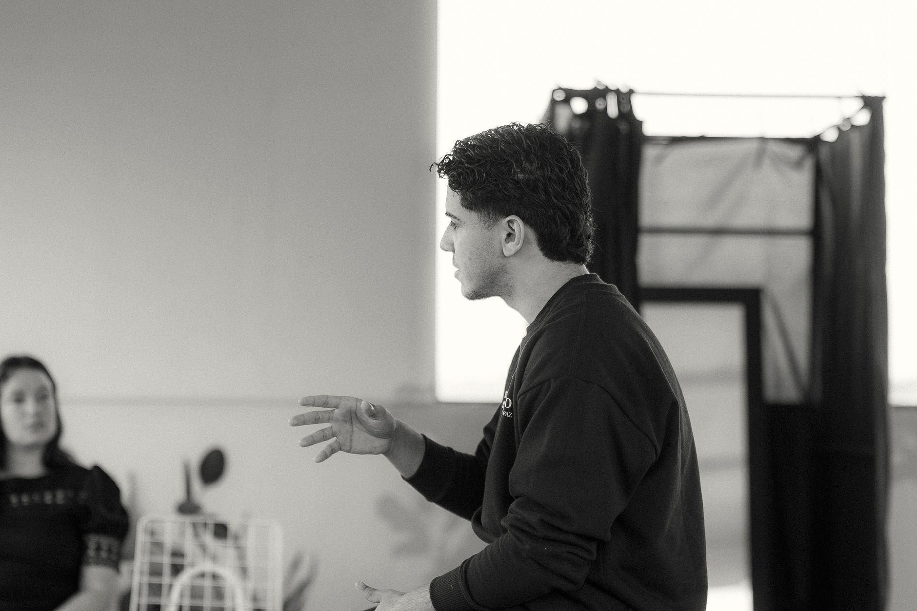 A photo of a speaker engaging with an audience, highlighting the importance of body language. — persuasion techniques
