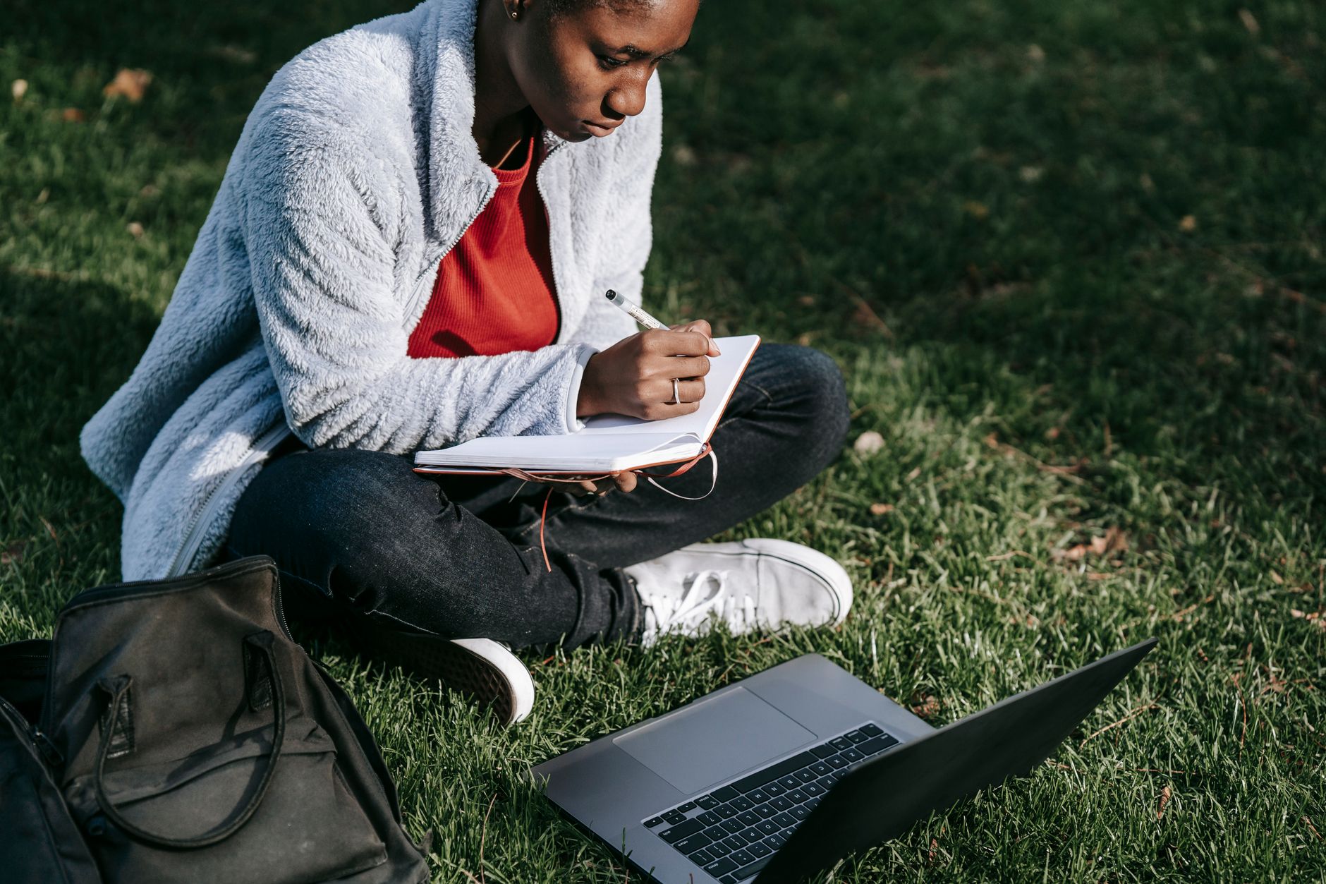 A photo of a student researching debate topics online, showcasing effective debate preparation techniques.