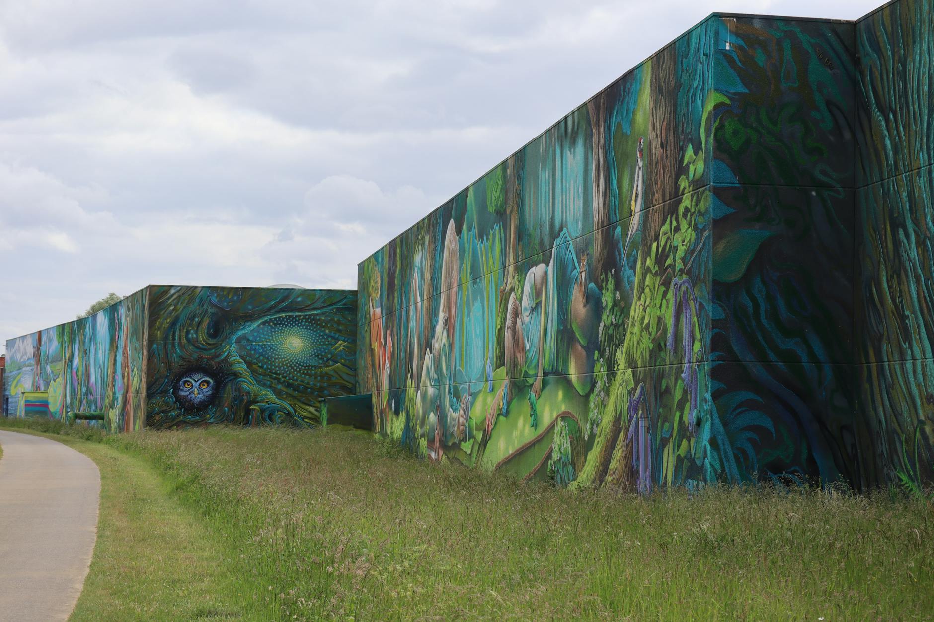A vibrant mural depicting social justice themes, showcasing the power of art in activism. — art activism debate