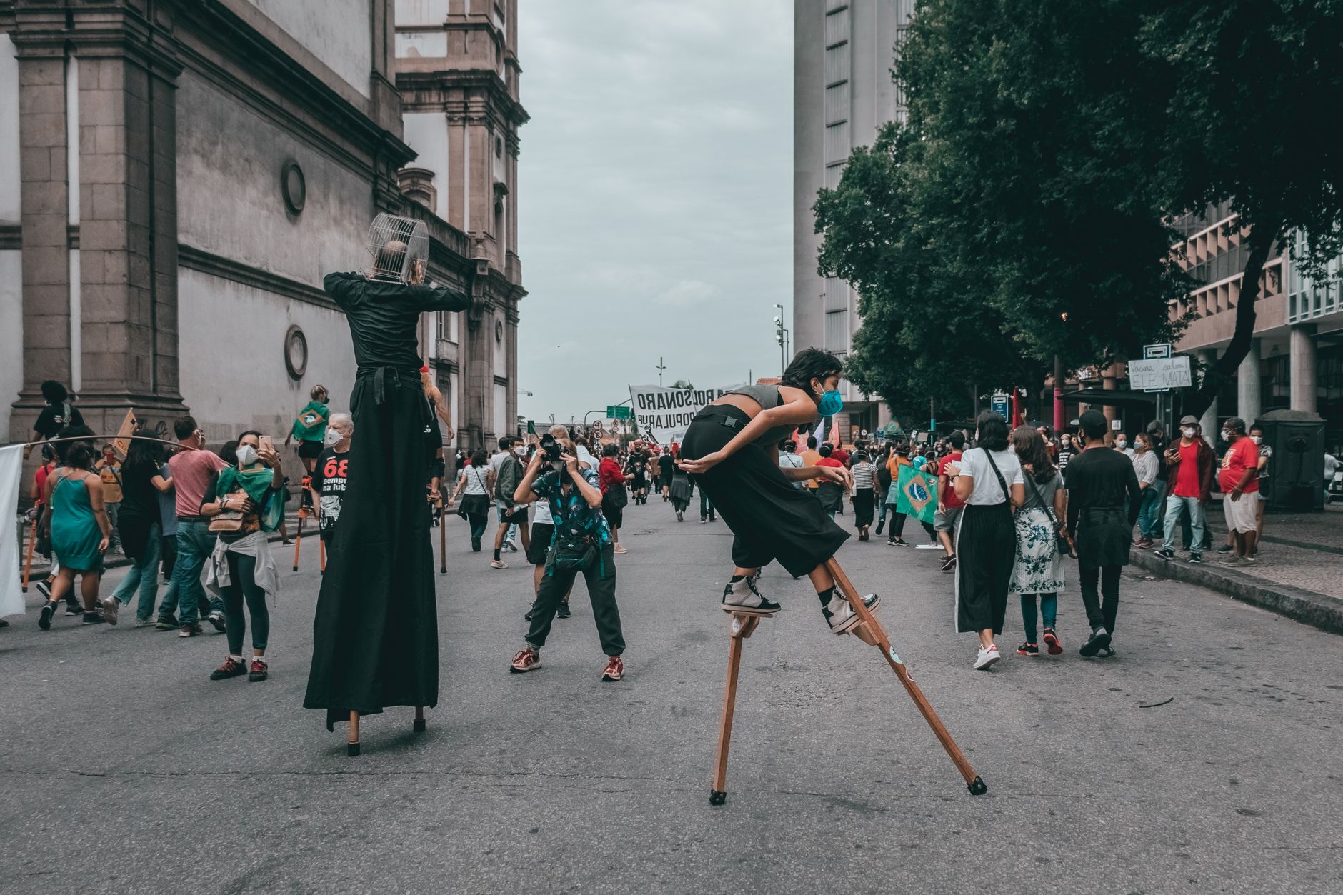 An artist performing at a public rally, capturing the essence of art as activism. — art and social change