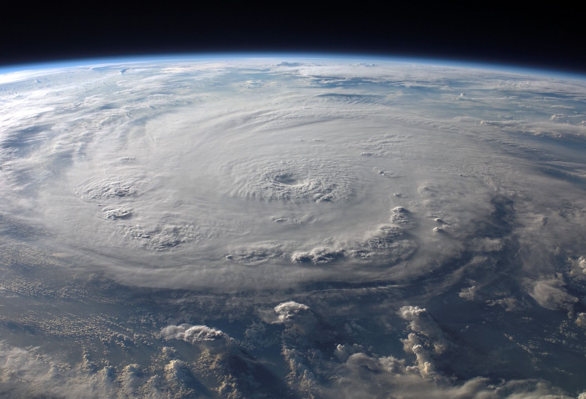 An image depicting NASA satellites monitoring climate change effects on Earth. — space vs earth debate