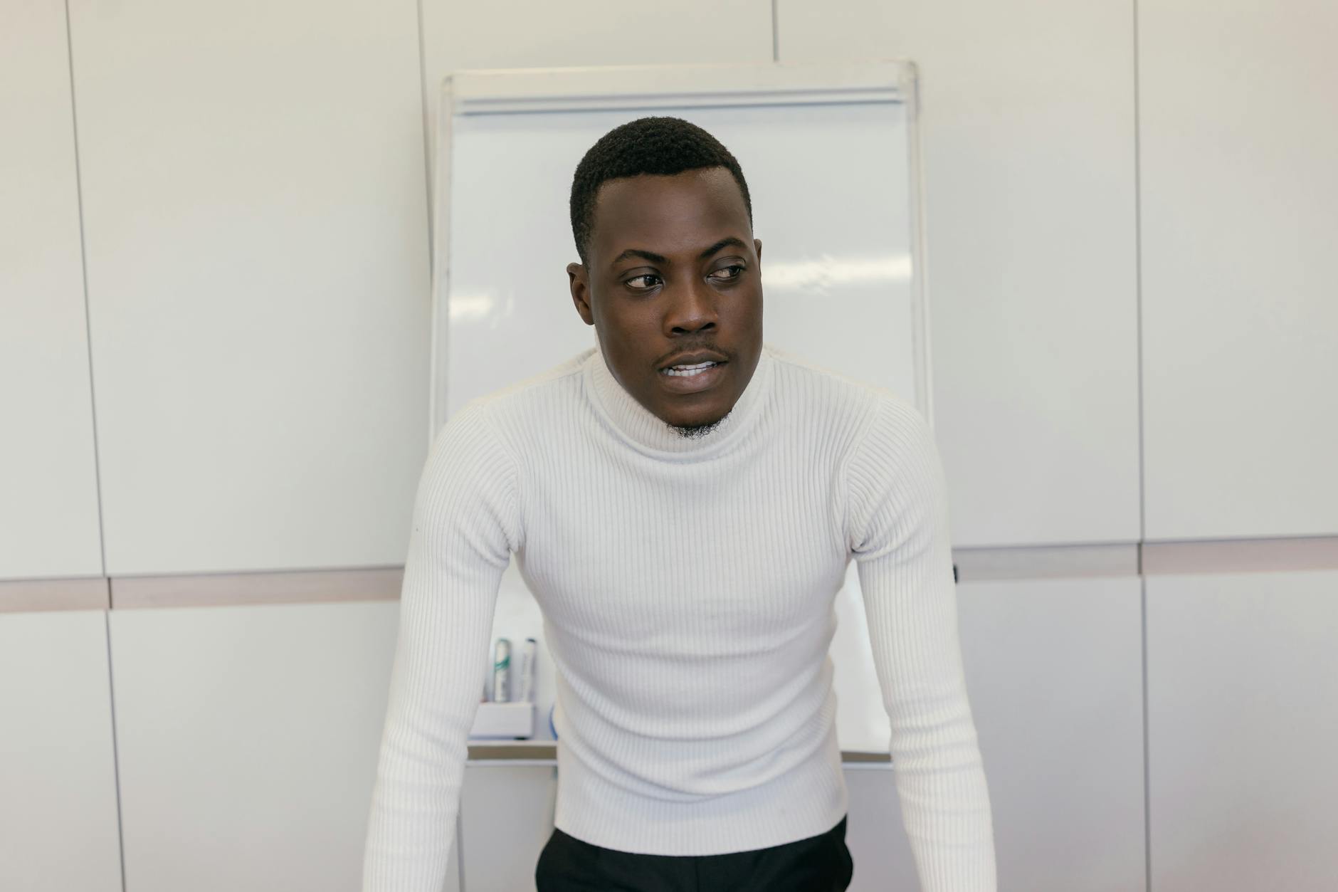 An individual practicing their speech in front of a mirror, focusing on body language. — debate club strategies