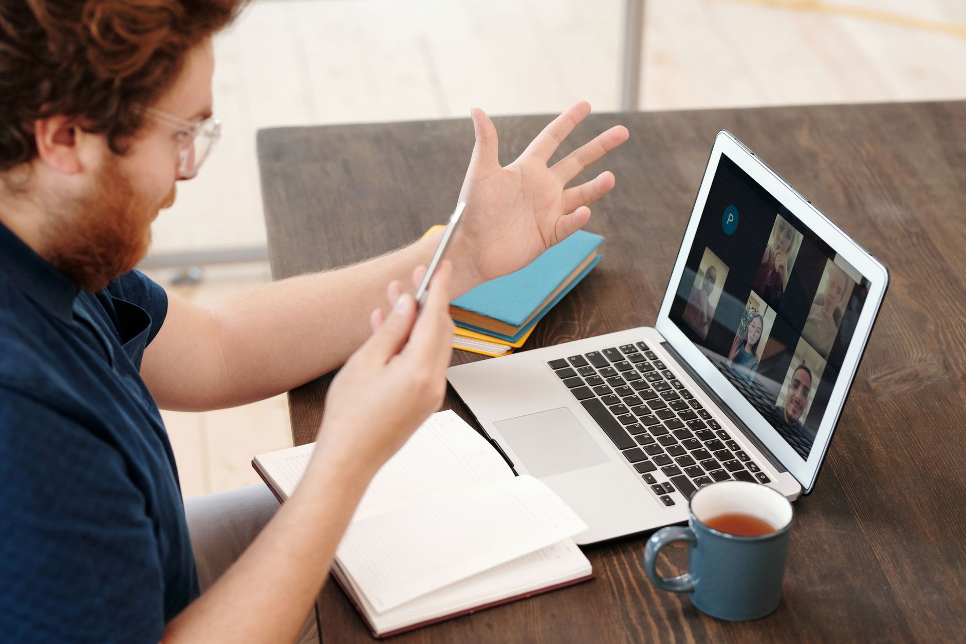An online debate workshop with participants using video conferencing tools, illustrating the modern approach to education debate skills.